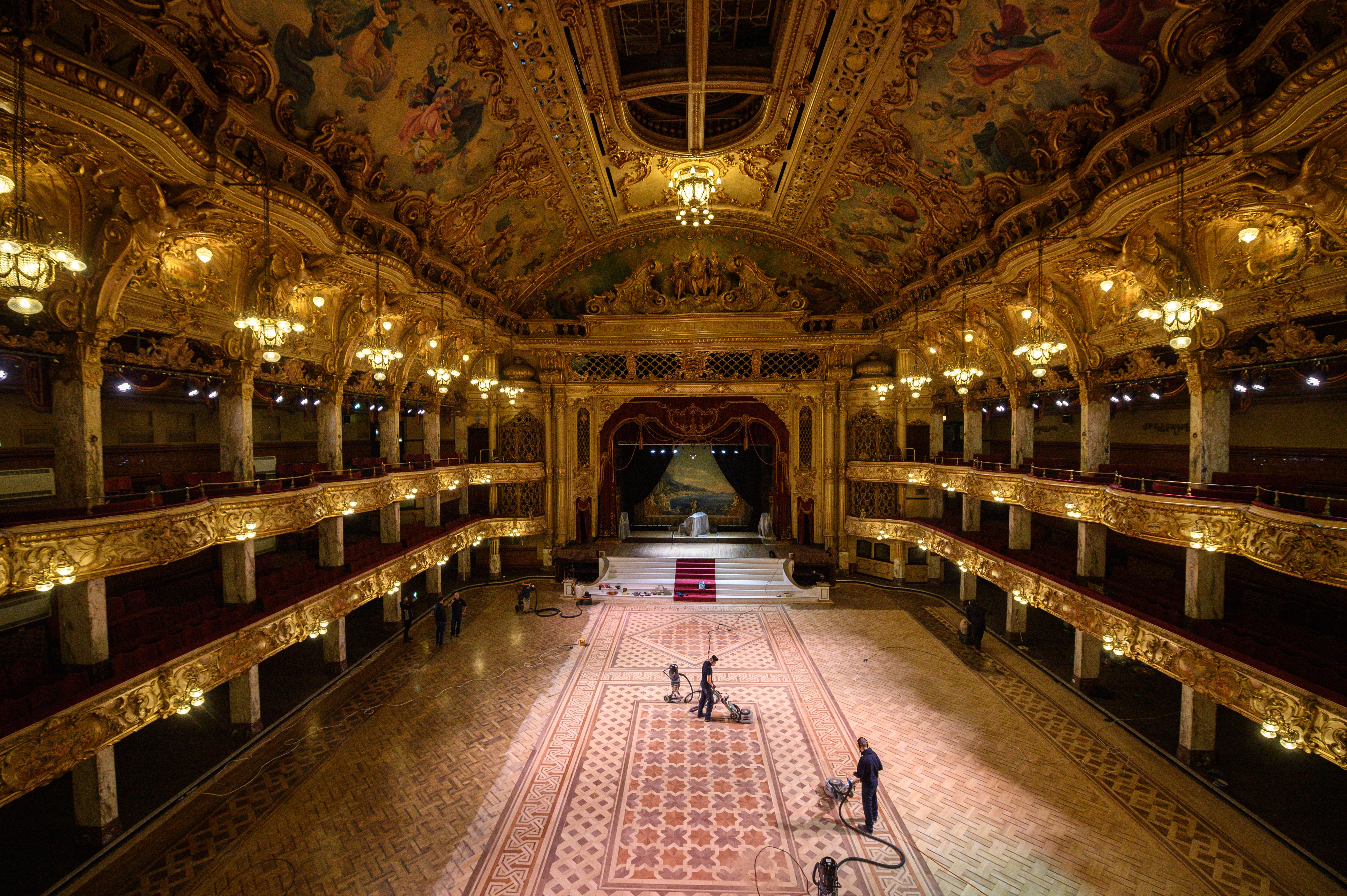 Wood sanding technicians work to restore the floor of the historic Blackpool Tower Ballroom (Oli Scarff/Blackpool Tower/PA)