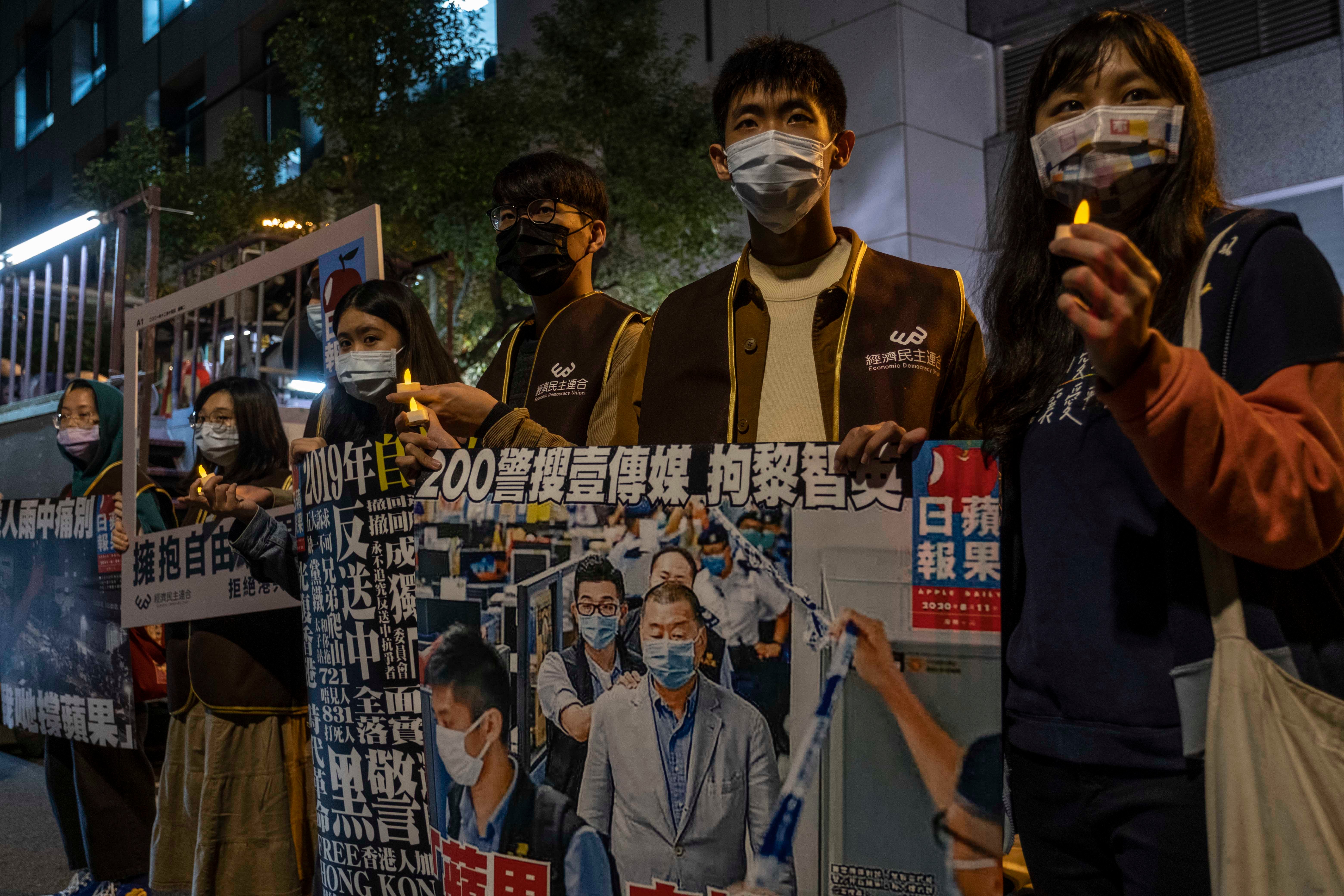 People take part in a demonstration in Taipei in support of the Taiwan Apple Daily in December 2021