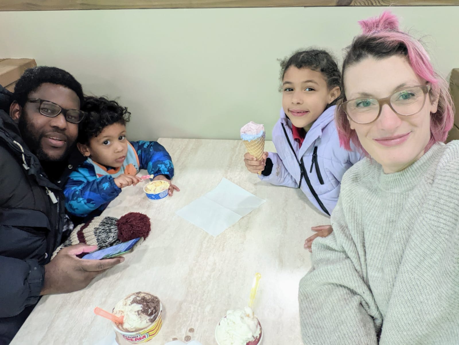 Cristina Feretti (right) and her young children were unable to spend Christmas with her husband, Christian Nkoyoh (left), after he was prevented from boarding a return flight from Italy