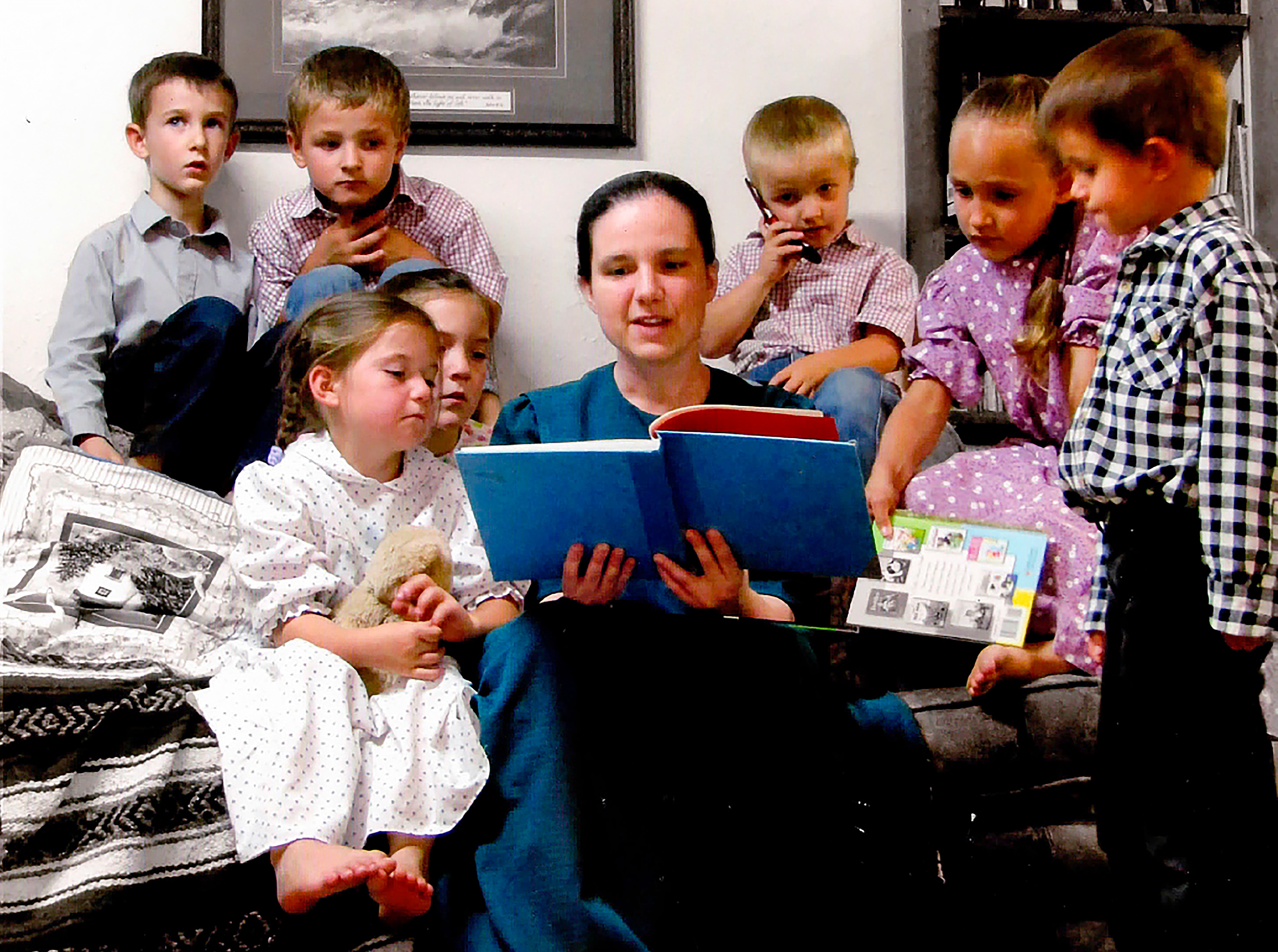 Sasha Krause, pictured here reading to children, was murdered in early 2020