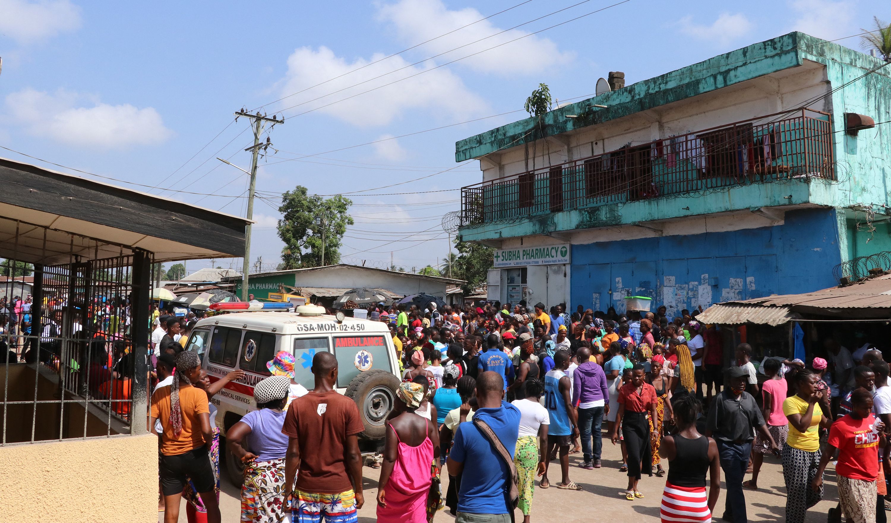 Family members and friends gather outside Redemption Hospital in Monrovia, Liberia, 20 January 2022