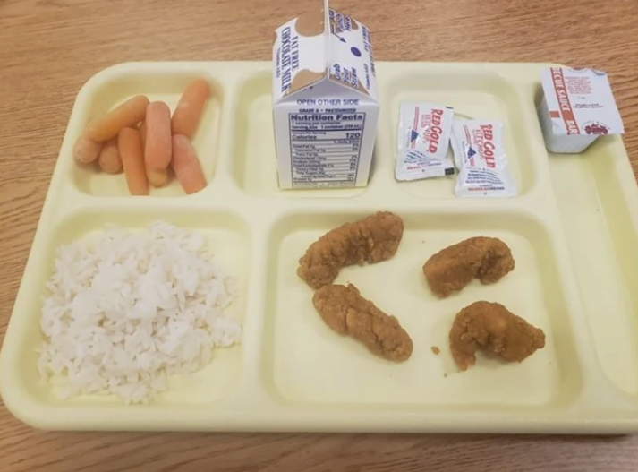 Chicken nuggets, a lump of rice and a handfull of carrots is served for lunch at one upstate New York school