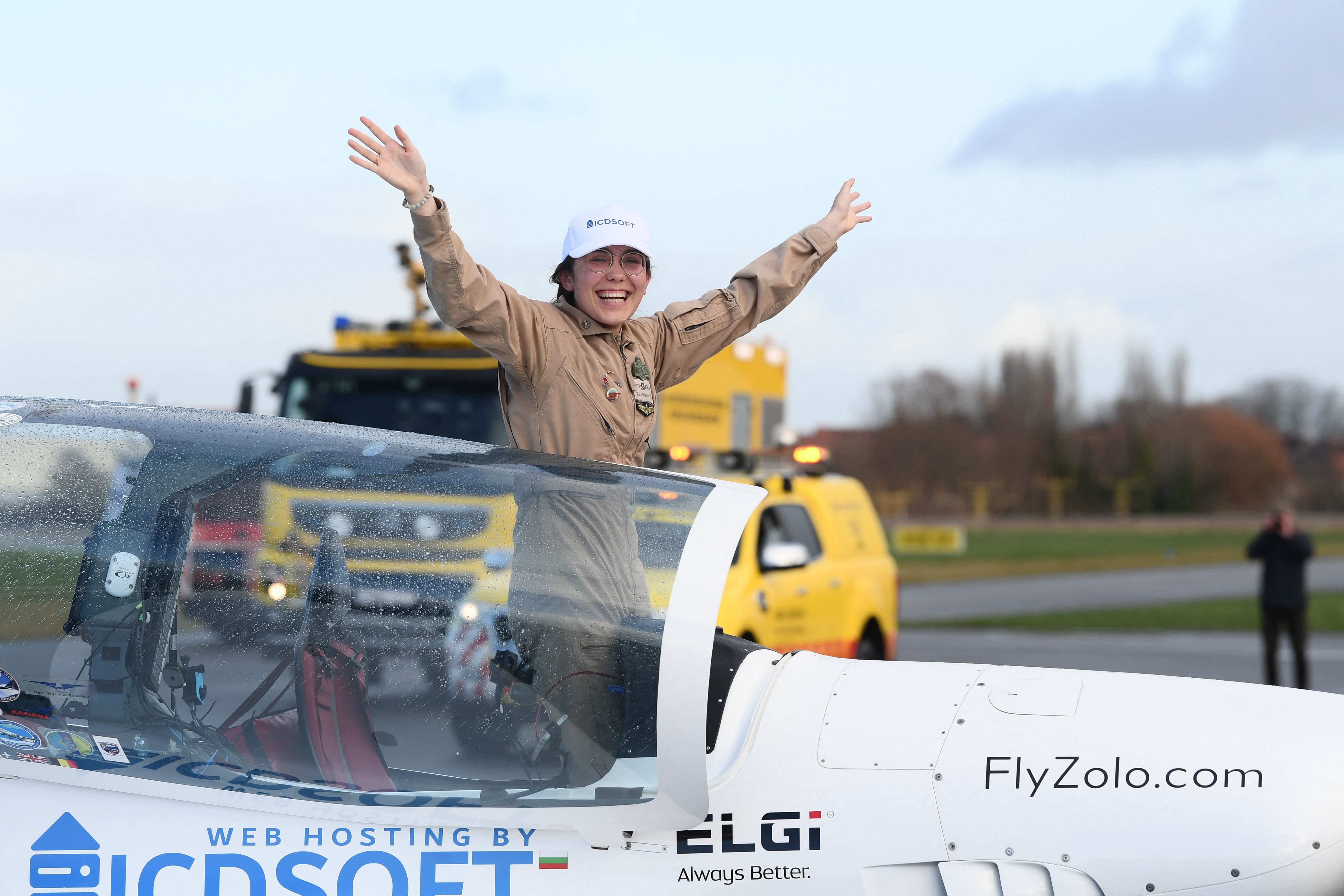 Rutherford celebrates as she lands in Belgium at the end of her trip