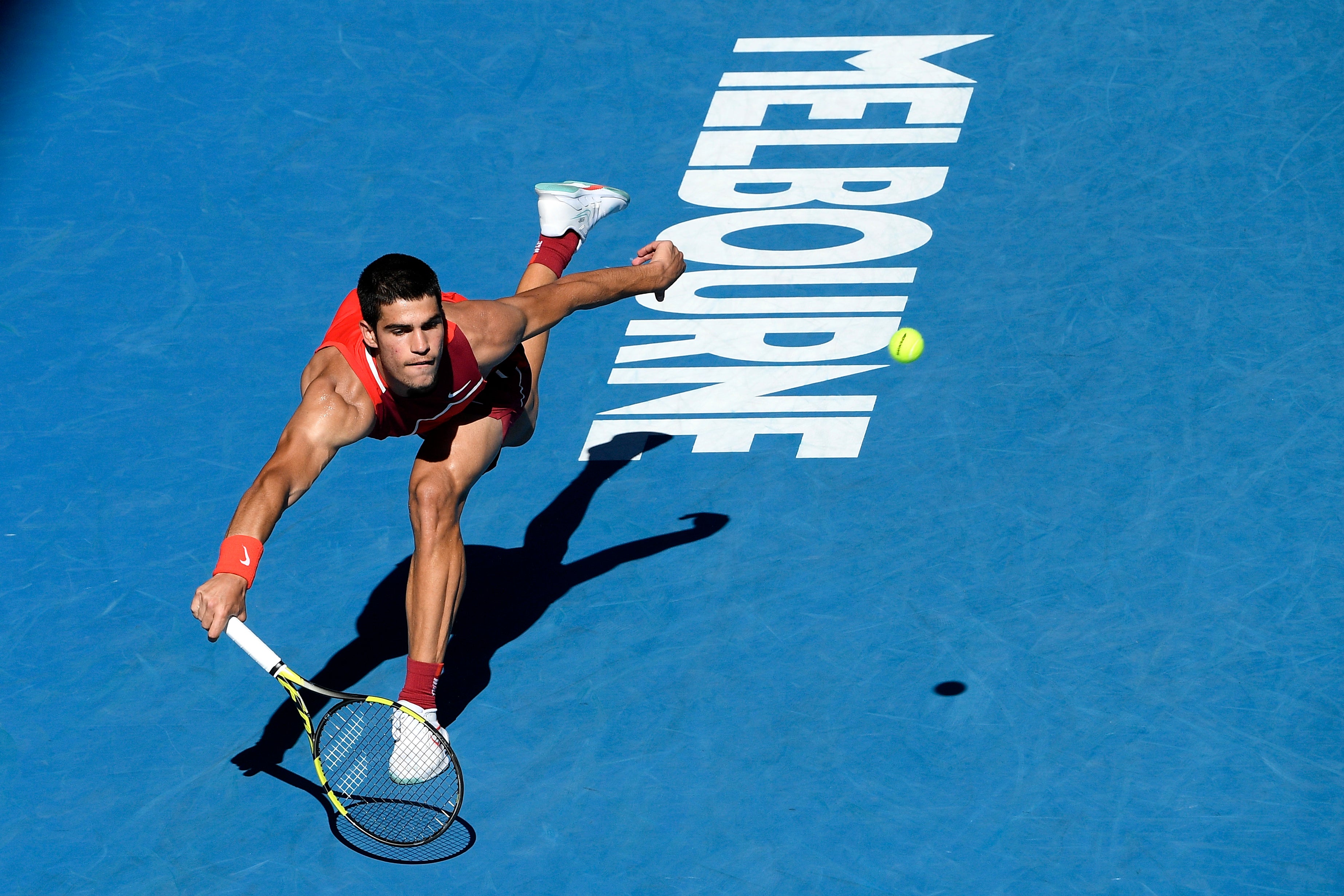 Carlos Alcaraz stretches for a forehand (Andy Brownbill/AP)