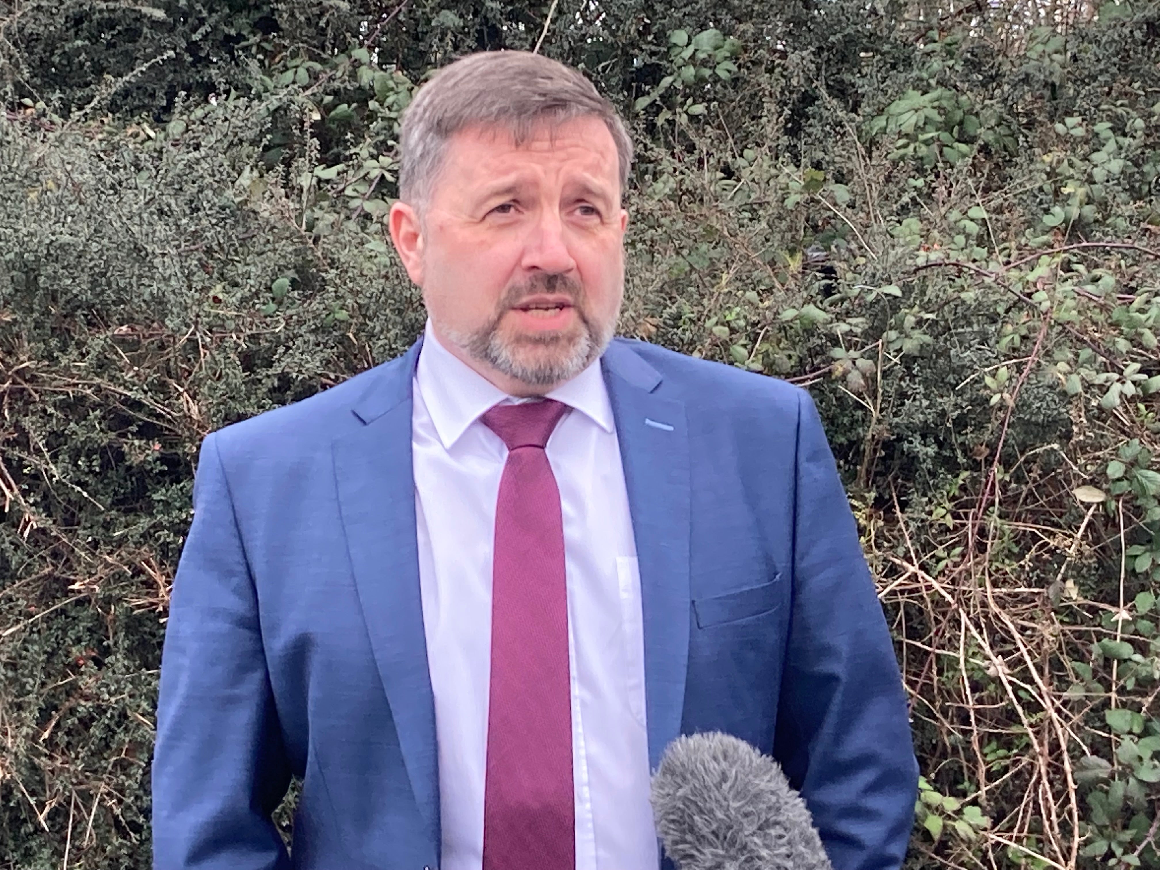 Health Minister Robin Swann speaks to reporters at Dunsilly, Co Antrim (Rebecca Black/PA)