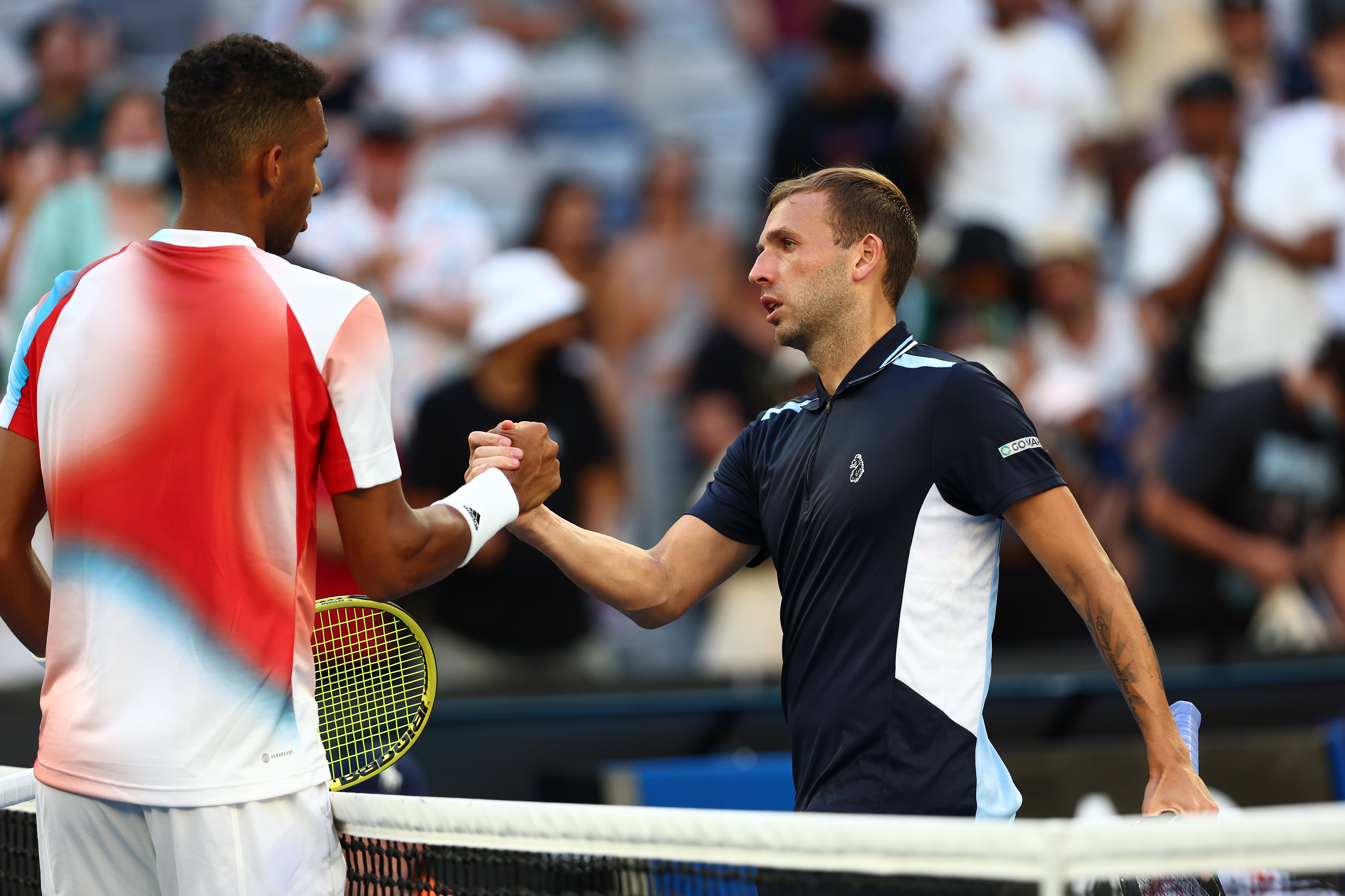 Dan Evans congratulates Felix Auger-Aliassime