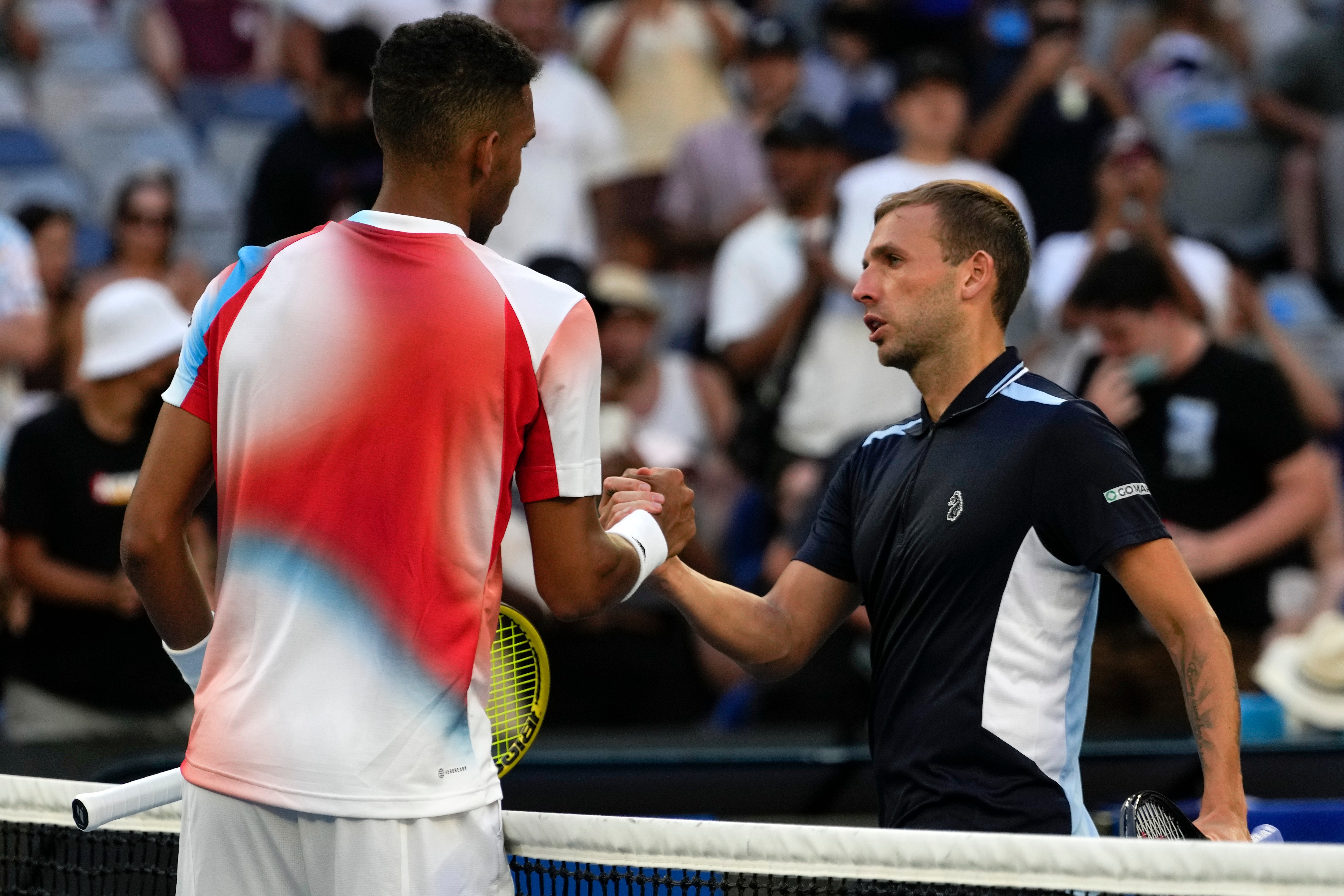 Dan Evans, right, was well beaten by Felix Auger-Aliassime (Simon Baker/AP)