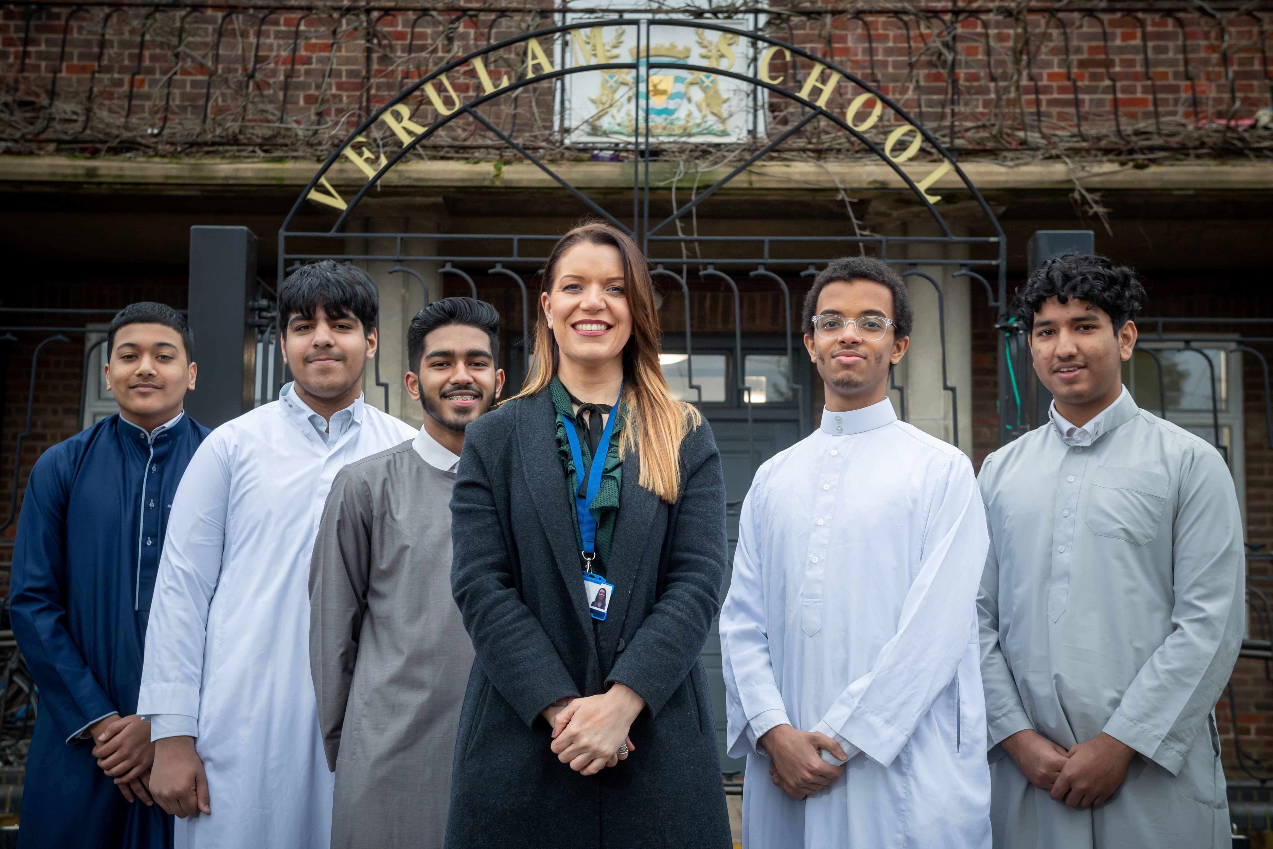 Head teacher Julie Richardson and some students with hair styles and beards that would have been unacceptable under previous rules at Verulam School in St Albans