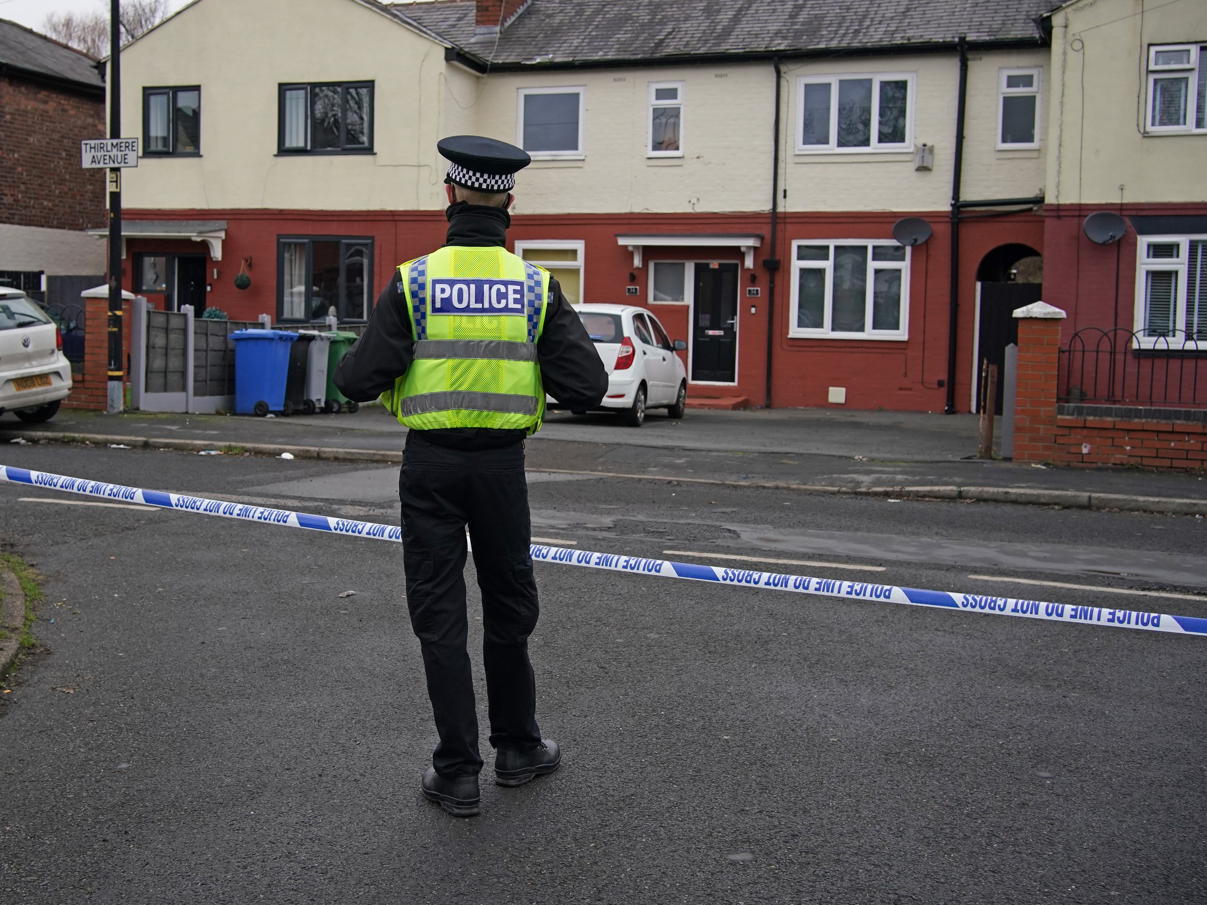 Police at the scene after a 16-year-old boy was fatally stabbed on on Thirlmere Avenue in Stretford, Manchester (PA)