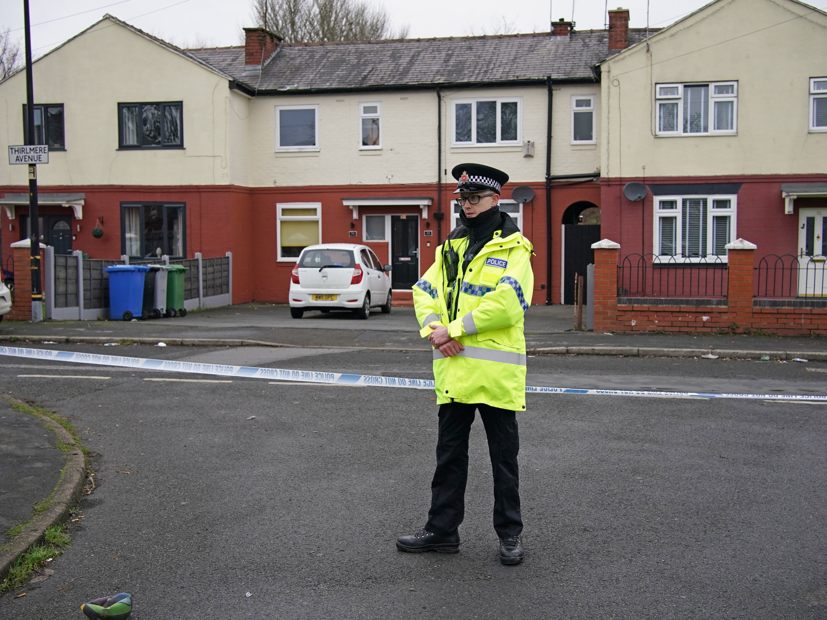 Police at the scene after a 16-year-old boy was fatally stabbed on Thirlmere Avenue in Stretford, Manchester