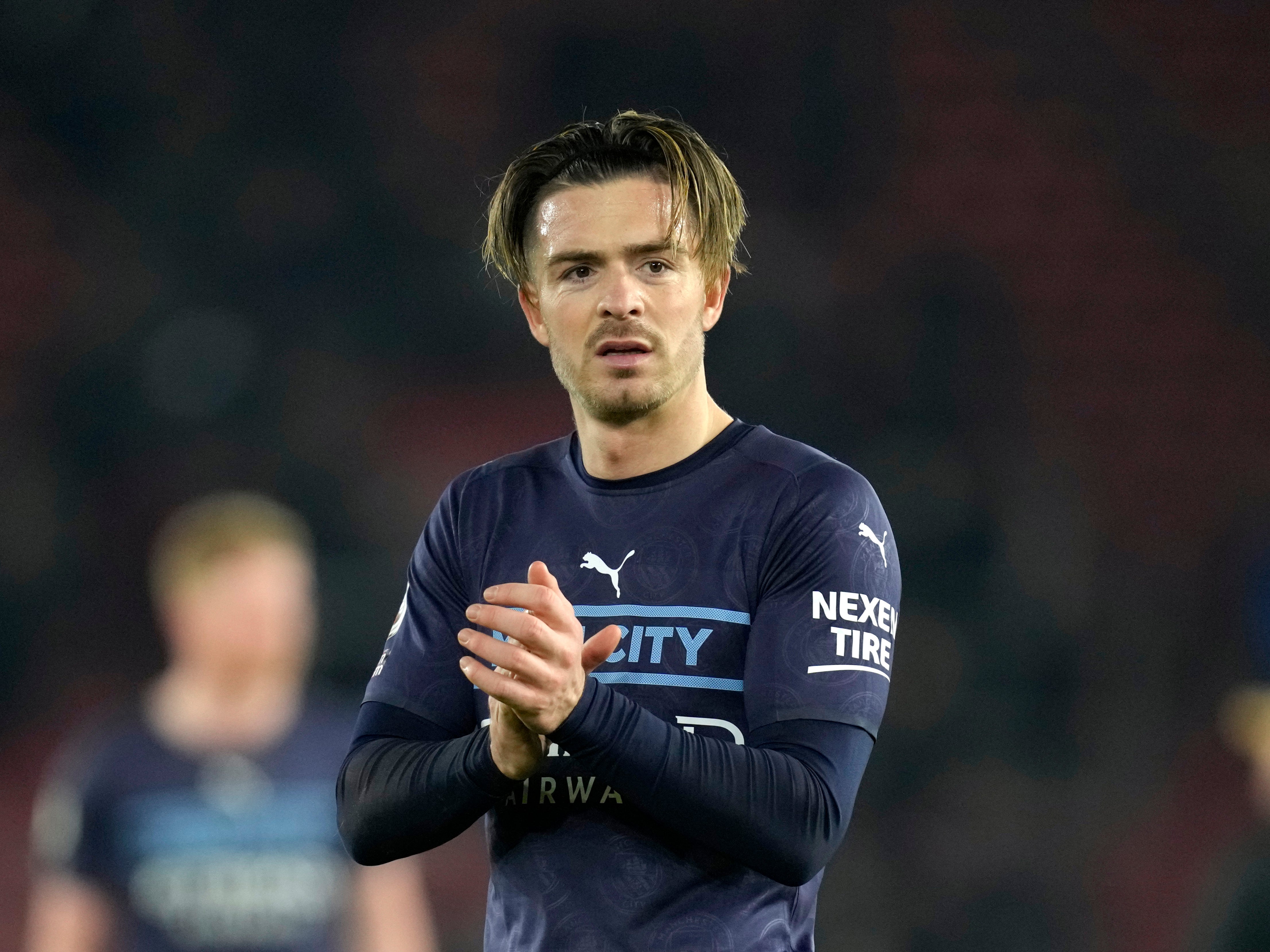 Jack Grealish applauds the travelling Man City fans