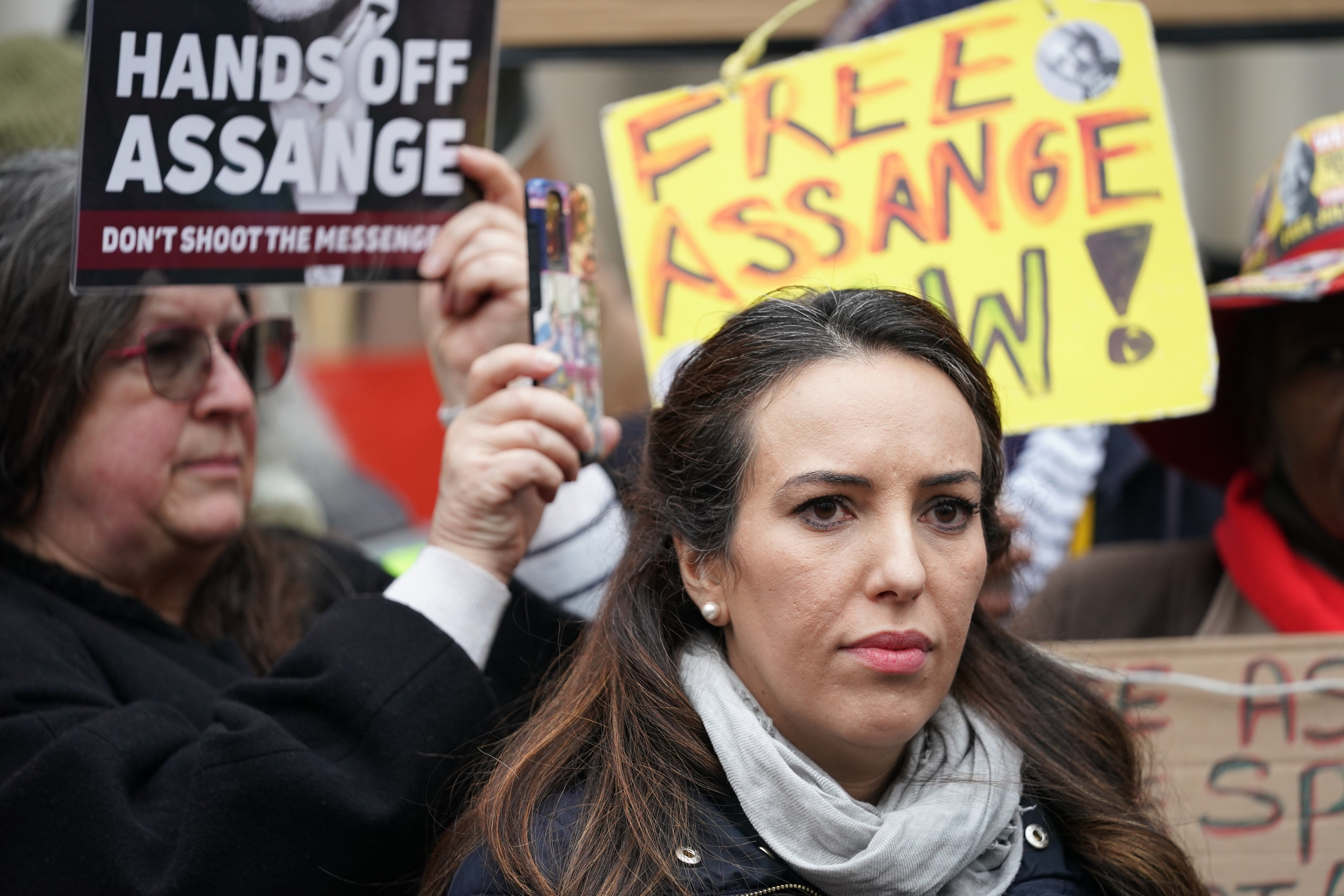 Stella Moris, the partner of Julian Assange, speaks to the media outside the Royal Courts of Justice in London, after the Wikileaks founder won the first stage of his bid to appeal against the decision to extradite him to the United States to the Supreme Court (Kirsty O’Connor/PA)