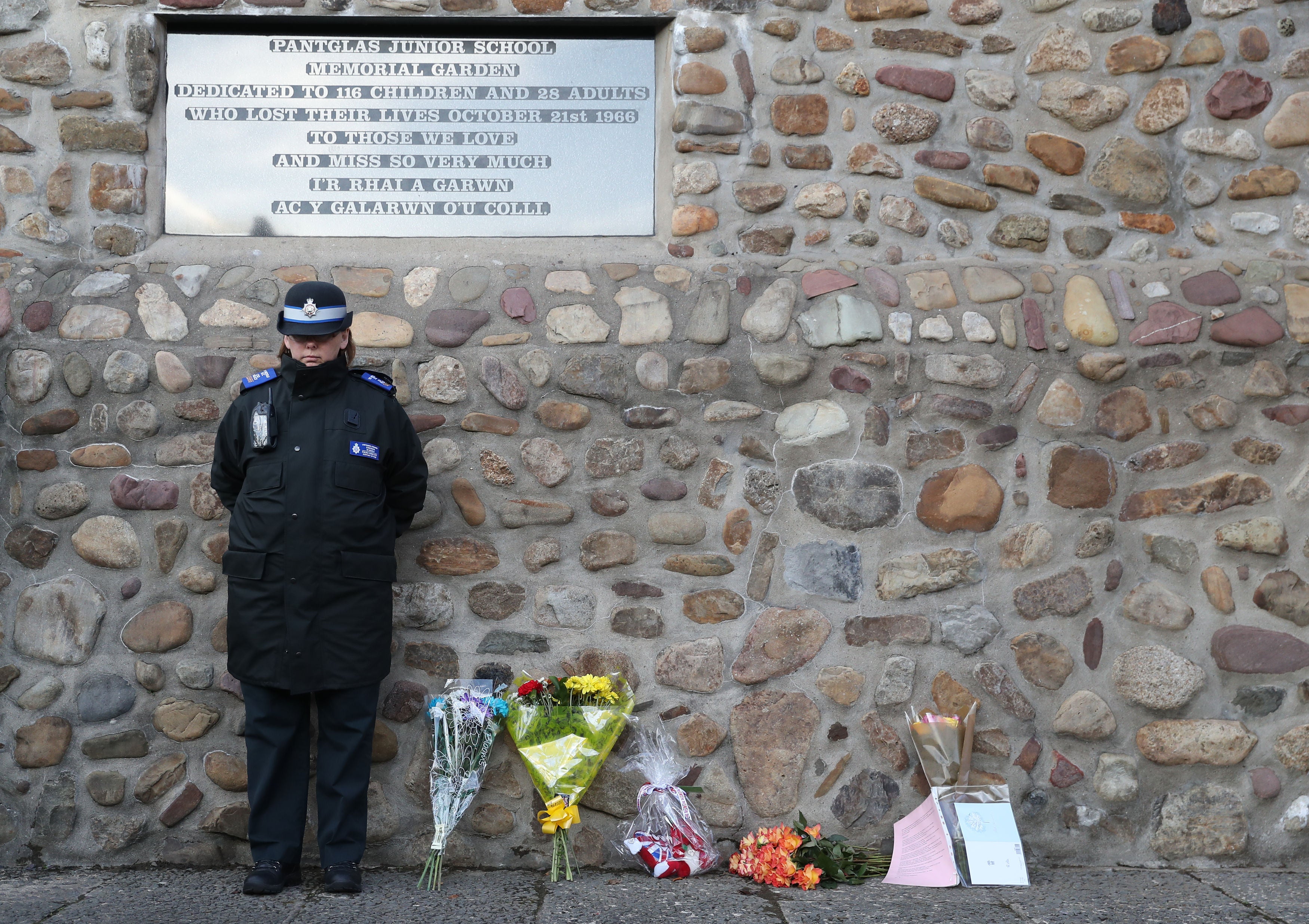 A minute’s silence is observed for the victims of the Aberfan disaster outside the Aberfan Memorial Gardens in the village in Wales, on the 50th anniversary of the tragedy (Andrew Matthews/PA Archive)