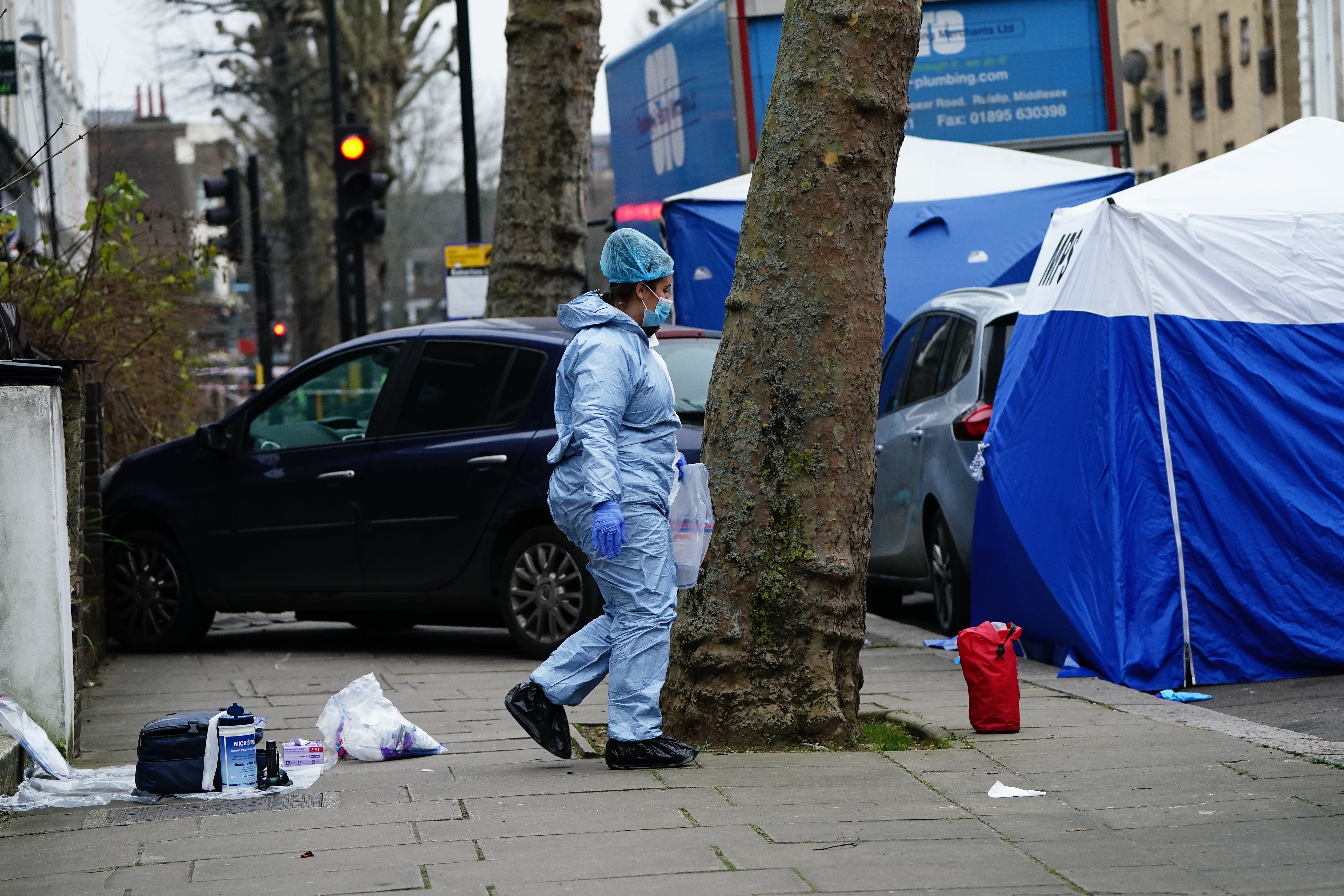 A Metropolitan Police officer at the scene on Chippenham Road (Aaron Chown/PA)