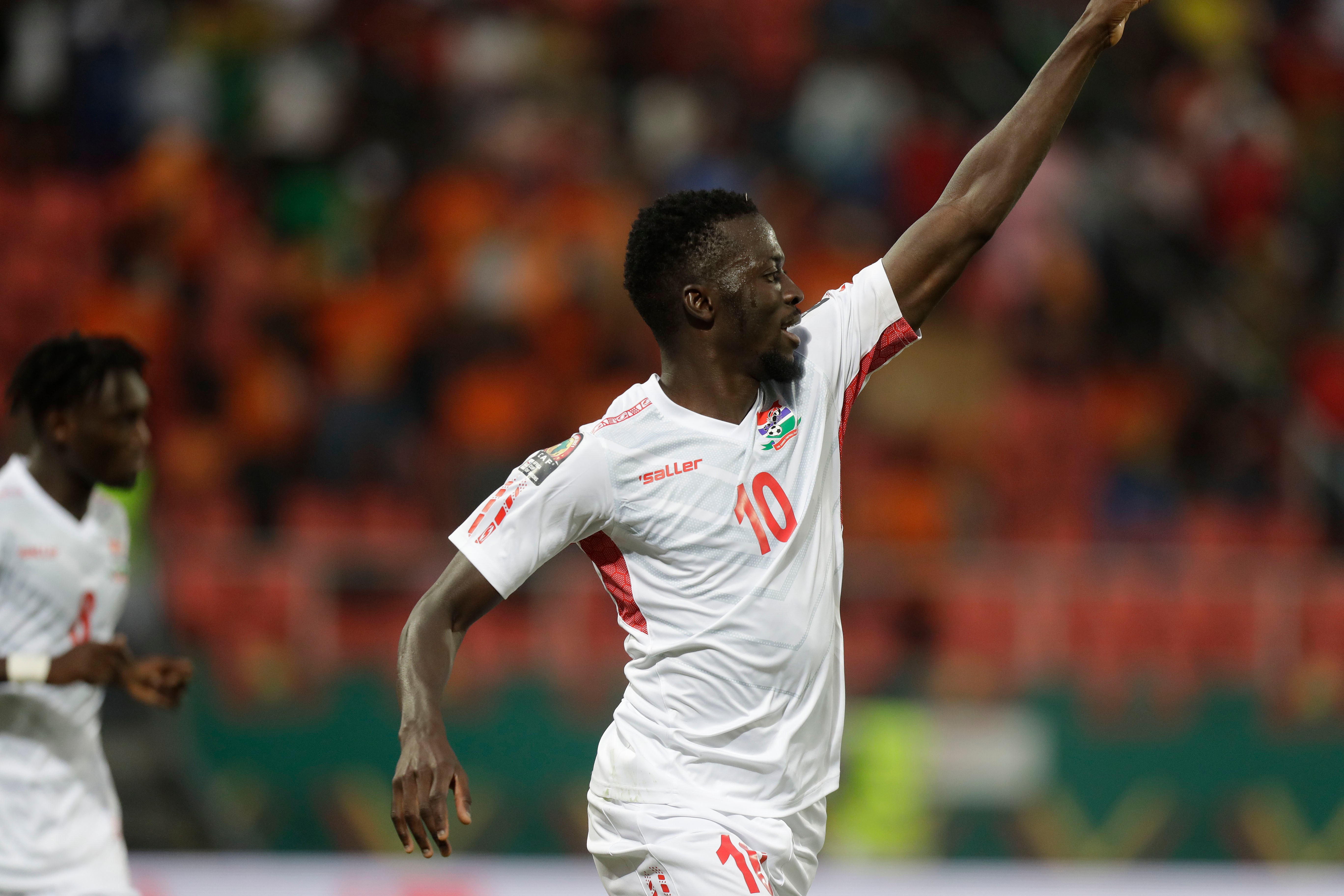 Musa Barrow celebrates after scoring Gambia’s winner in their Africa Cup of Nations victory over Guinea (Sunday Alamba/AP)