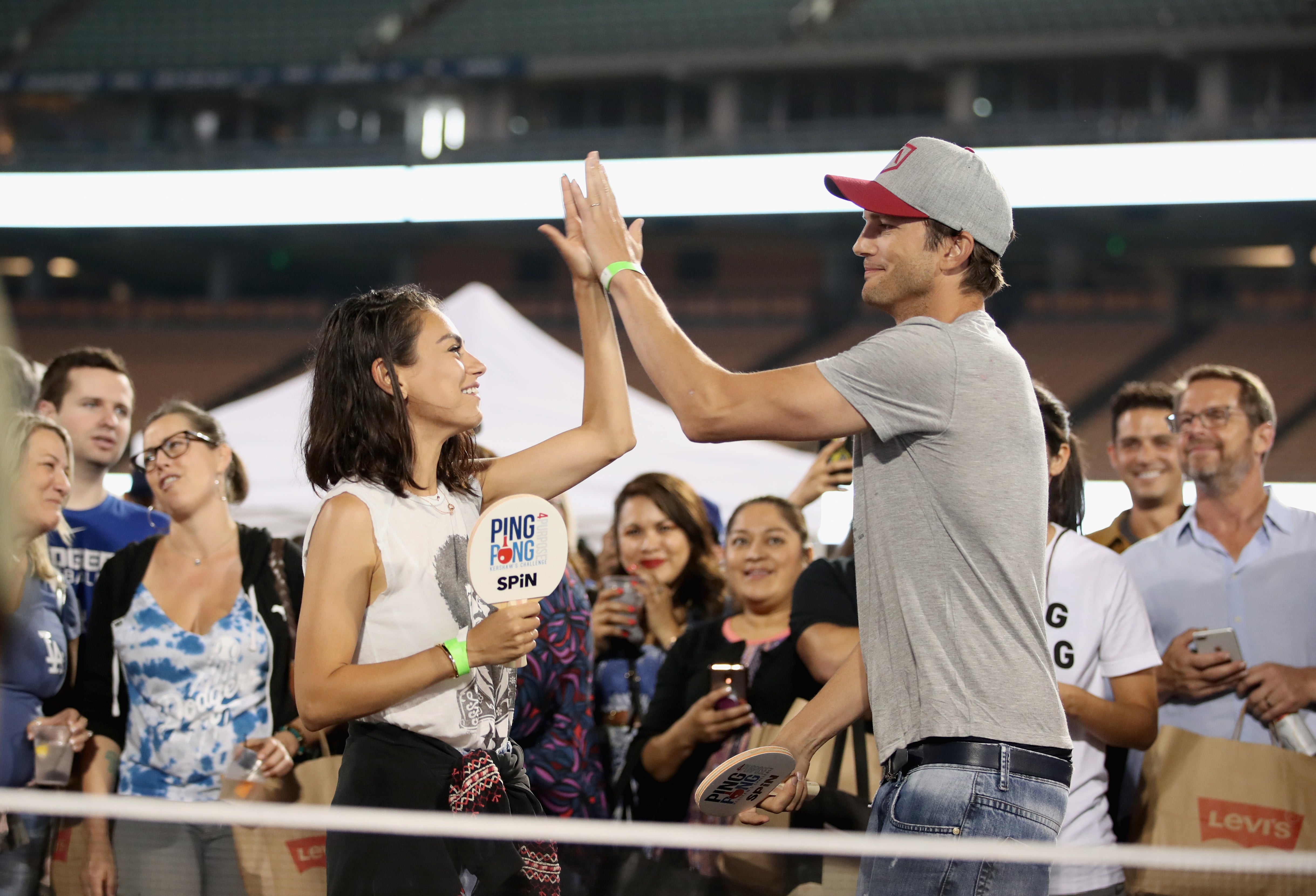 Mila Kunis and Ashton Kutcher play ping pong at Clayton Kershaw’s 6th Annual Ping Pong 4 Purpose in 2018