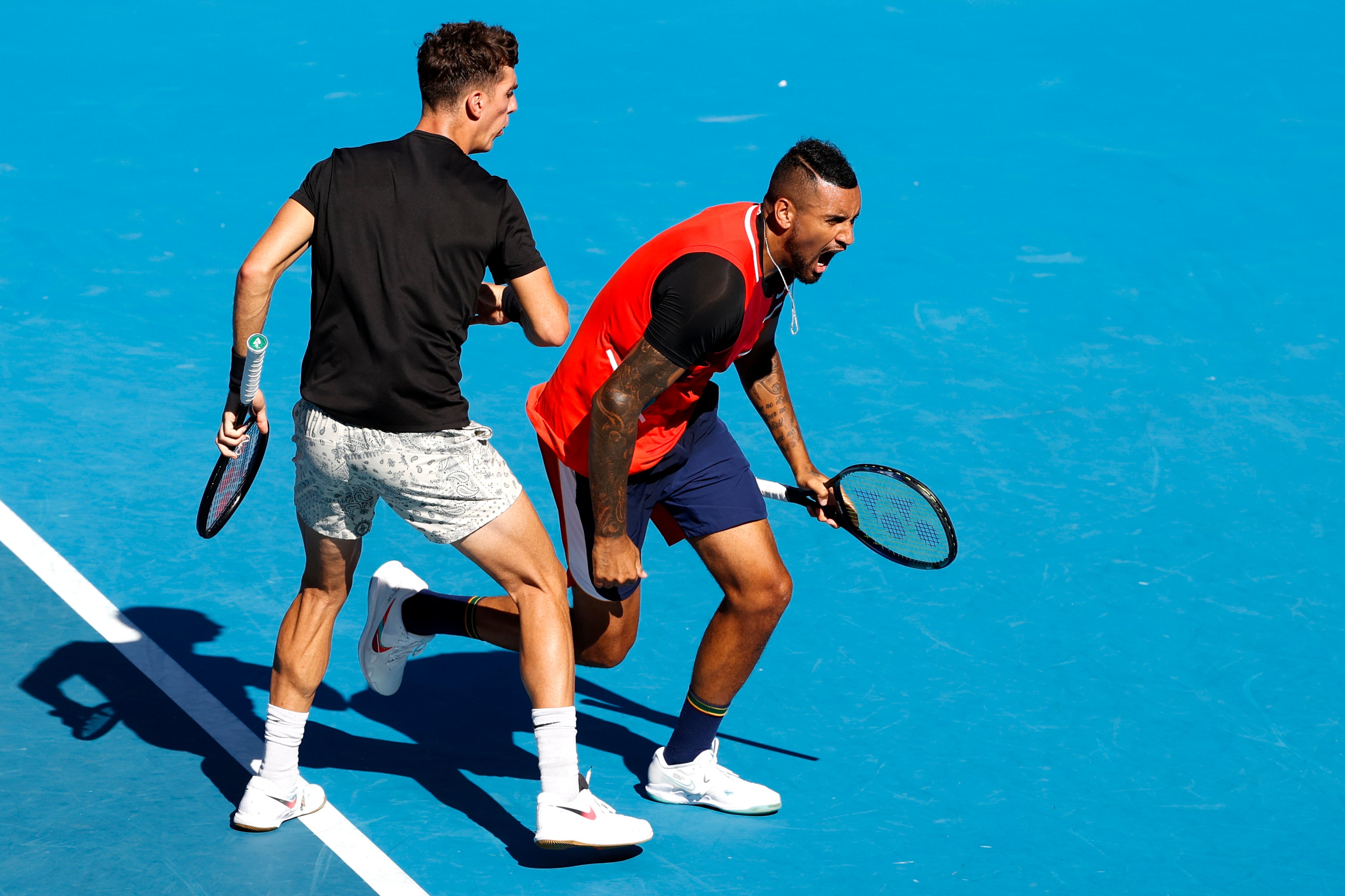 Nick Kyrgios, right, and Thanasi Kokkinakis celebrate during their Australian Open quarter-final win (Tertius Pickard/AP)