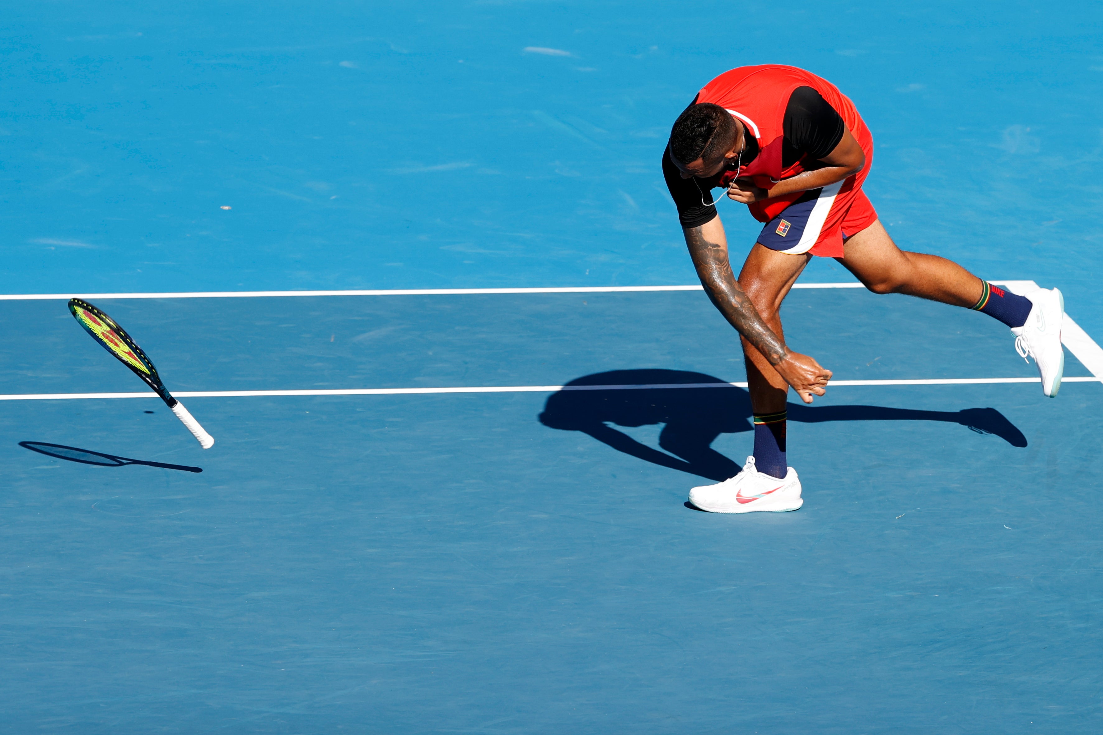 Nick Kyrgios throws his racket in frustration (Tertius Pickard/AP)