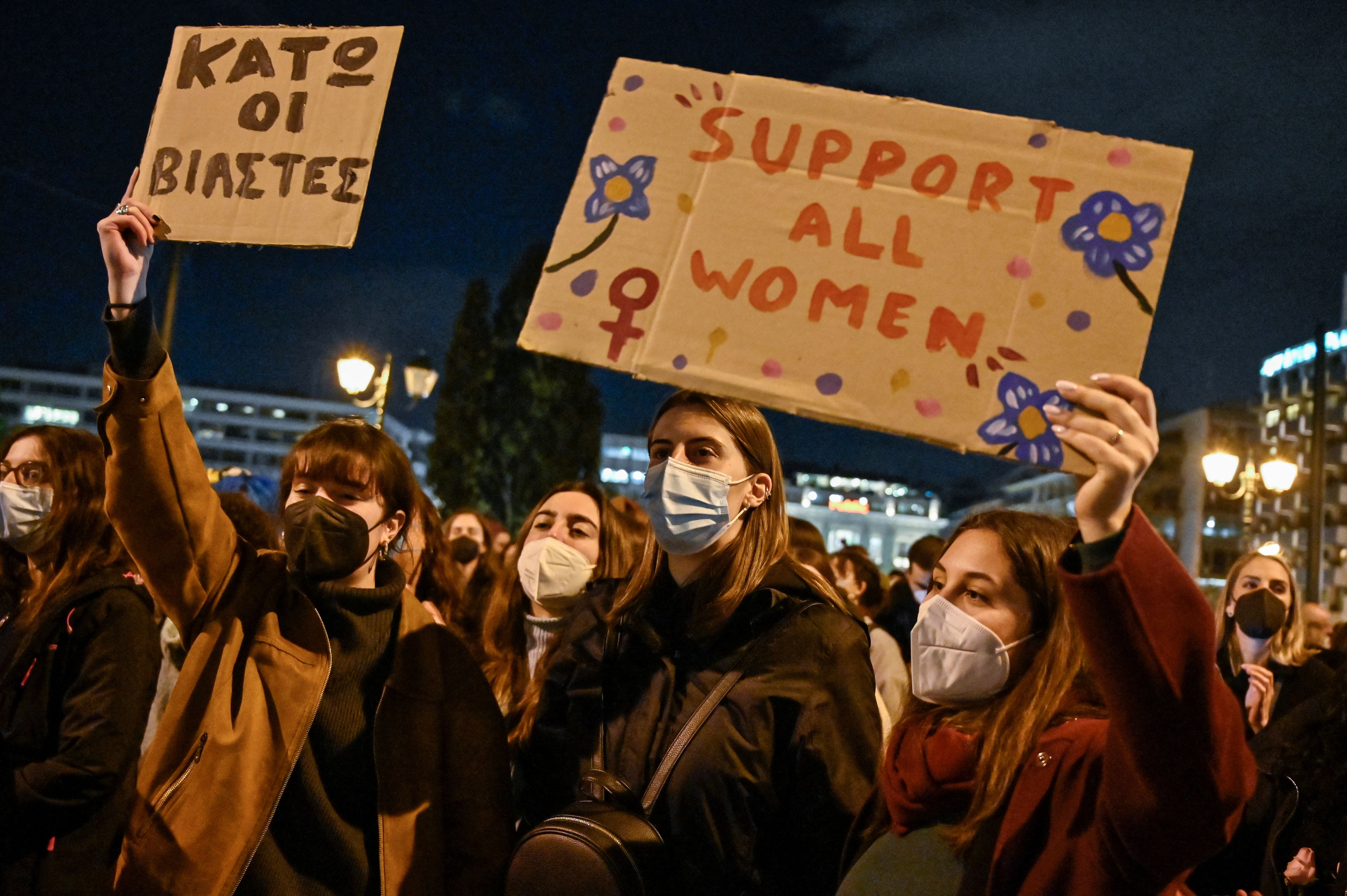 Women hold placards, one of them reading ‘Down with rapists’, during a demonstration in support of victims of rape in Athens last week