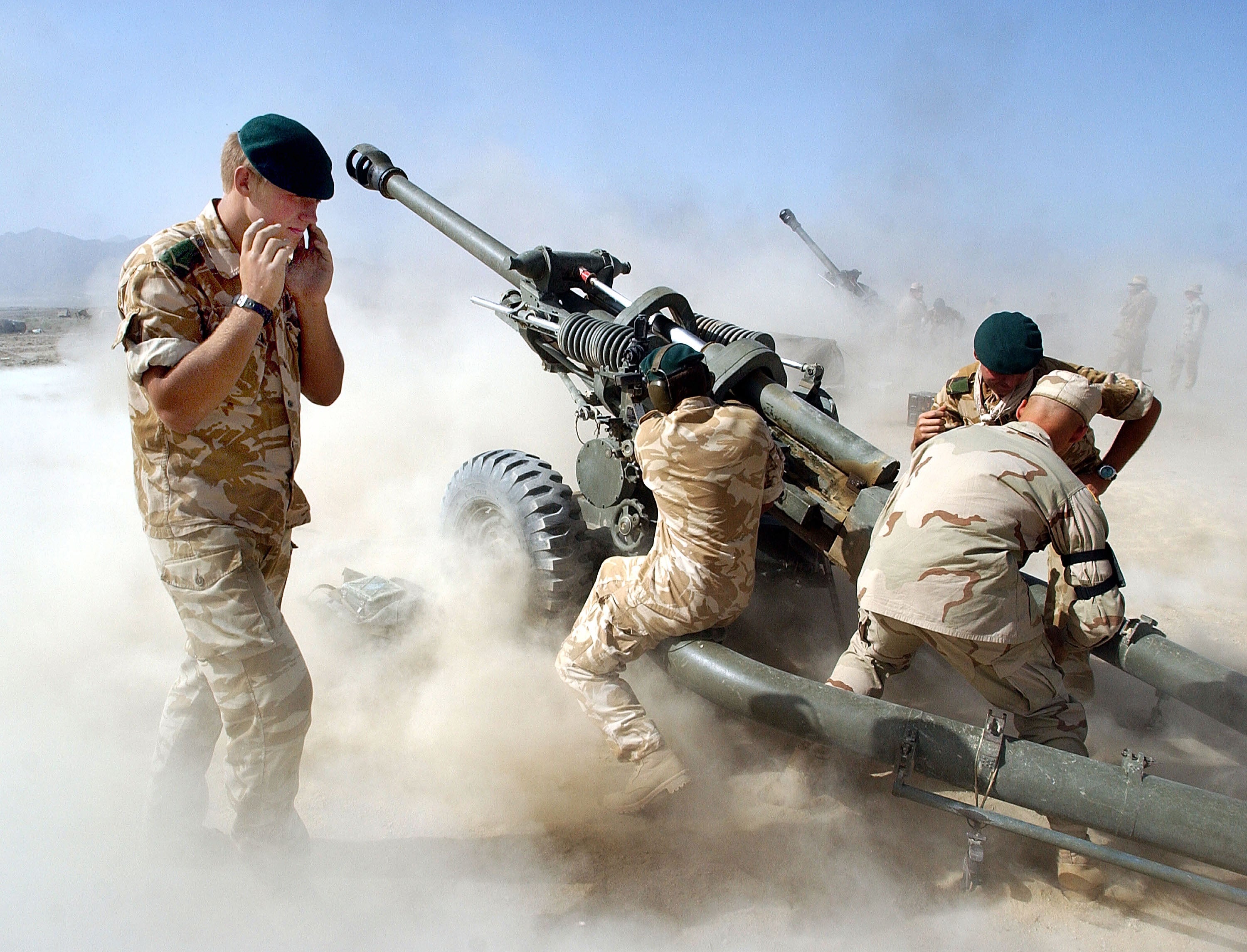 British and American forces fire 105mm artillery rounds during a live fire exercise in 2002 at Bagram airbase in Afghanistan