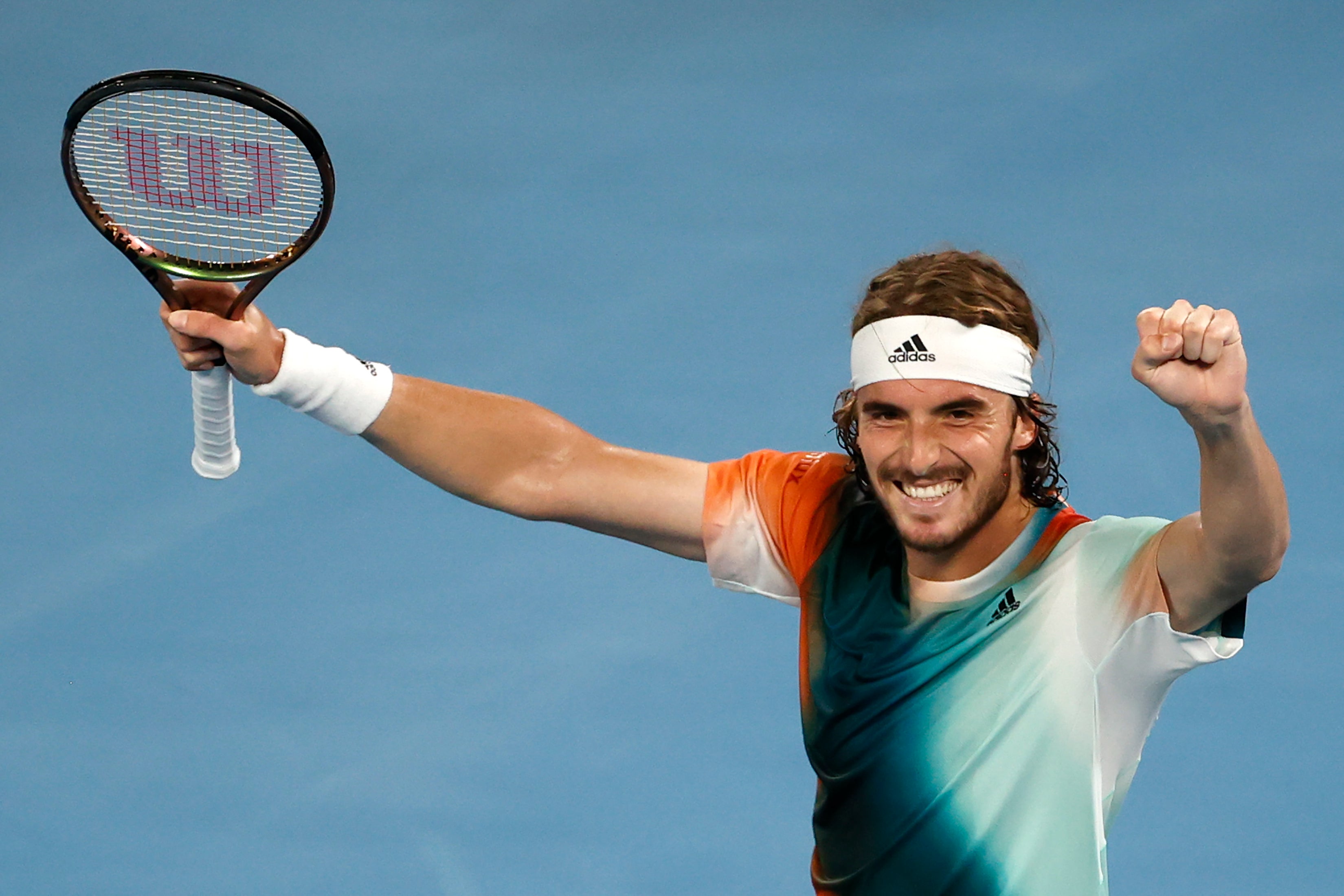 Stefanos Tsitsipas celebrates his victory over Jannik Sinner (Tertius Pickard/AP)