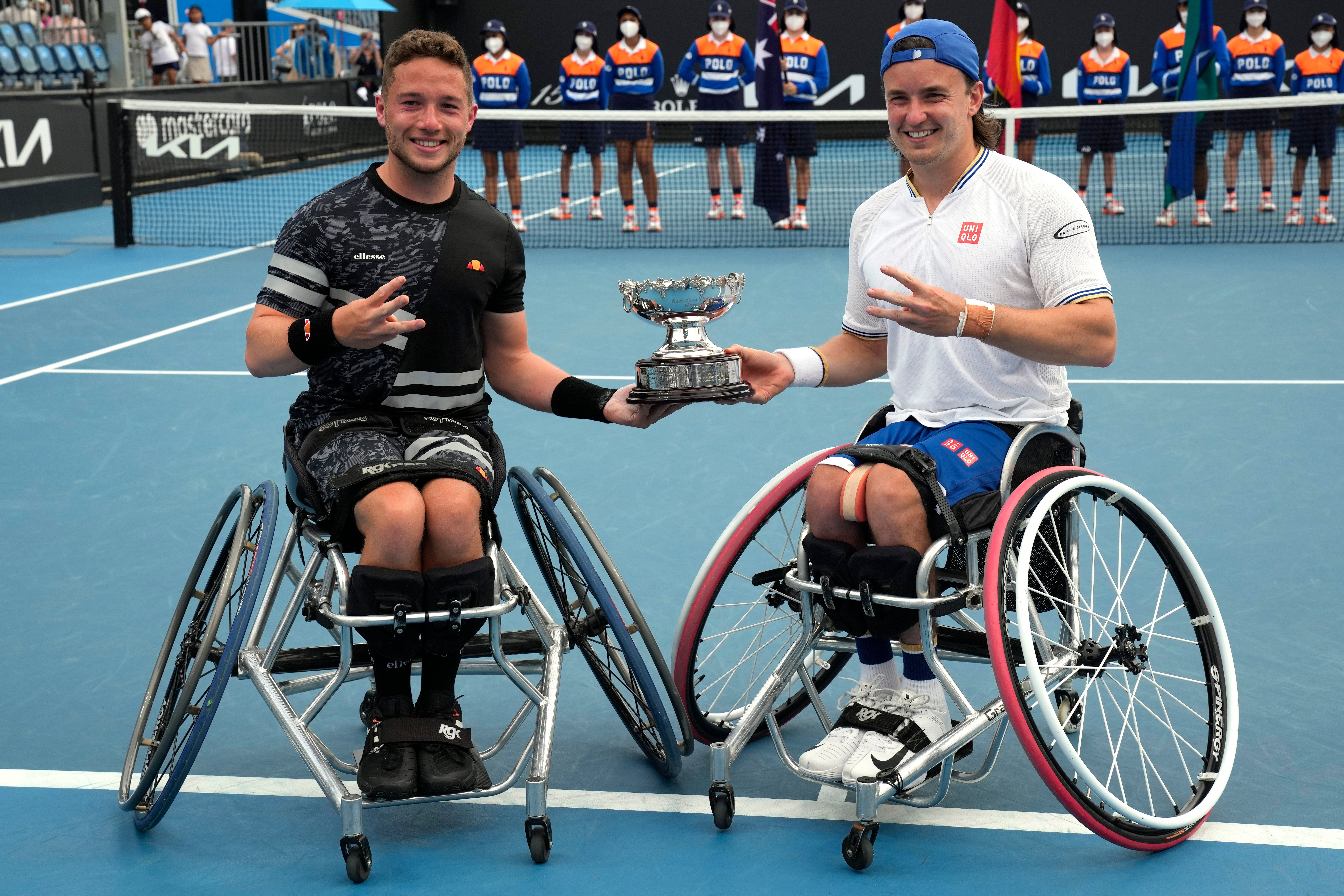 Alfie Hewett, left, and Gordon Reid of Britain pose with their trophy (Simon Baker/AP)