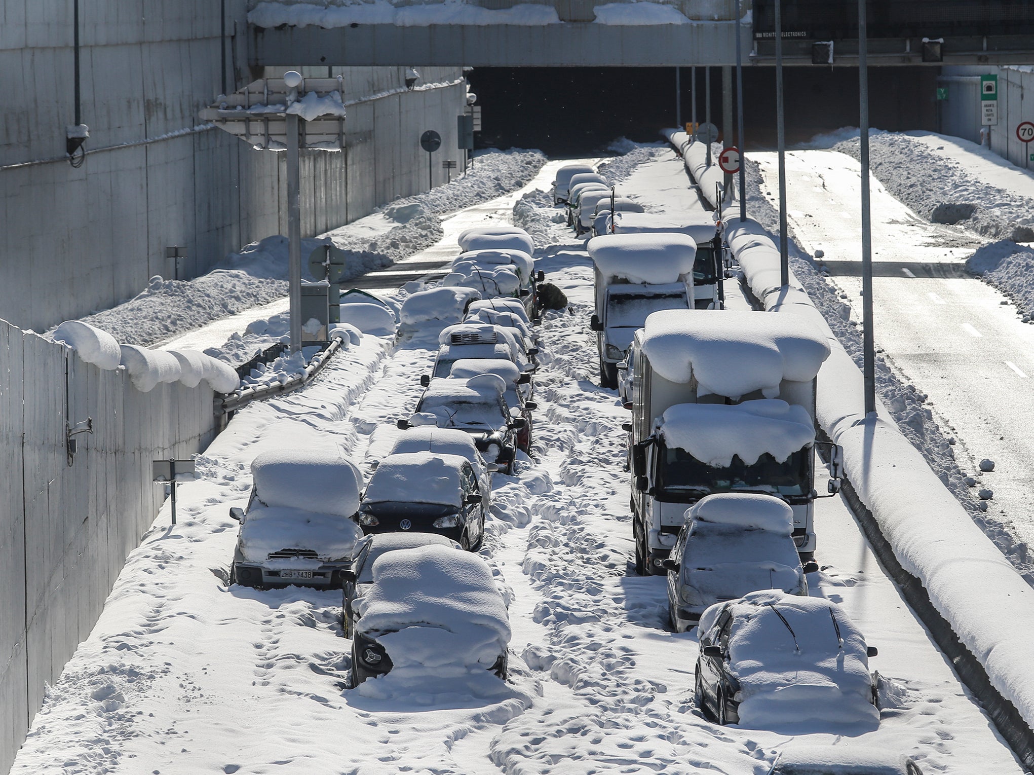 Cars are abandoned after being immobilised at Attiki Odos on the Athens main ring road