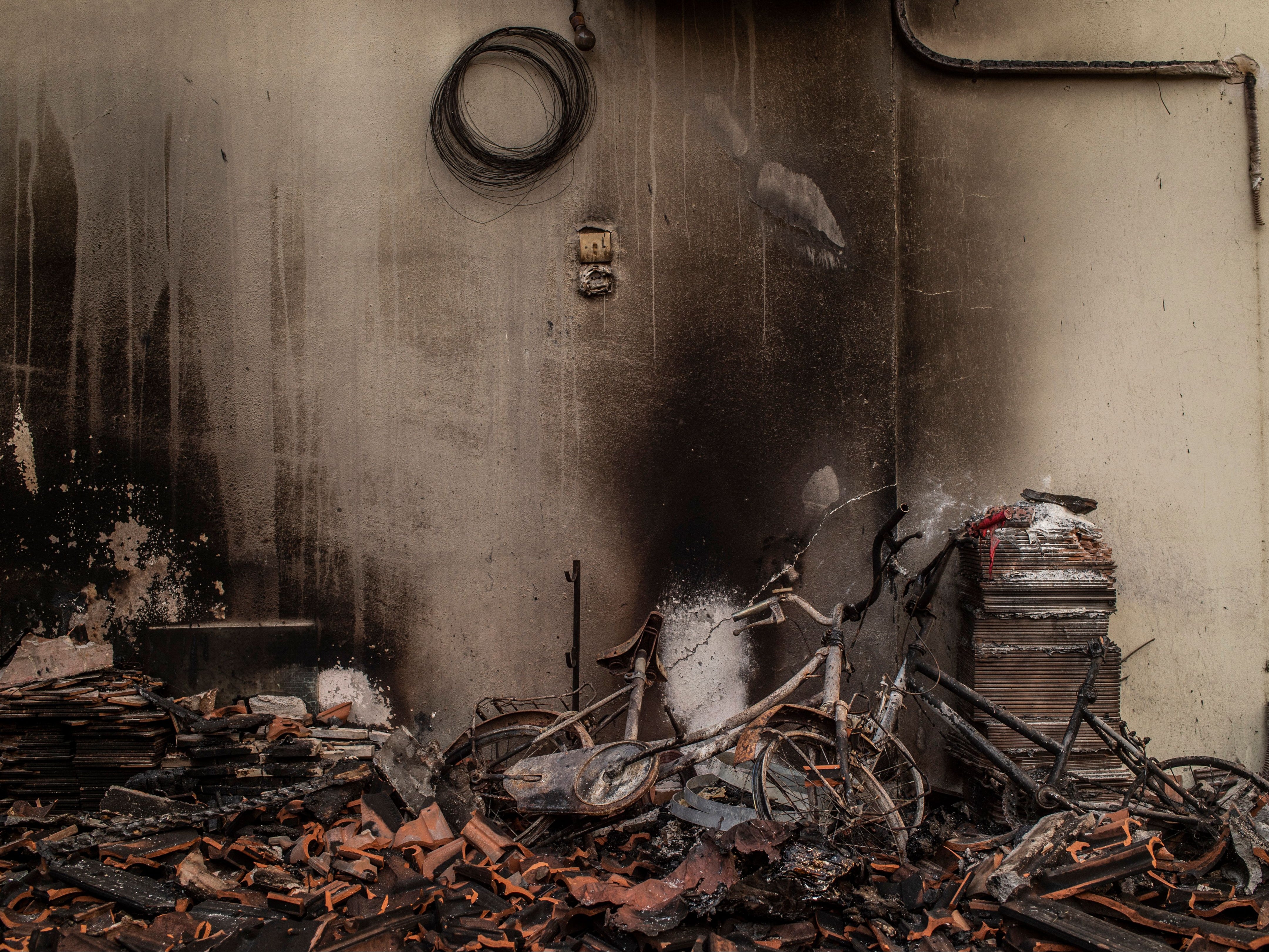 Houses were burned in a wildfire in the village of Kastri on Evia in August