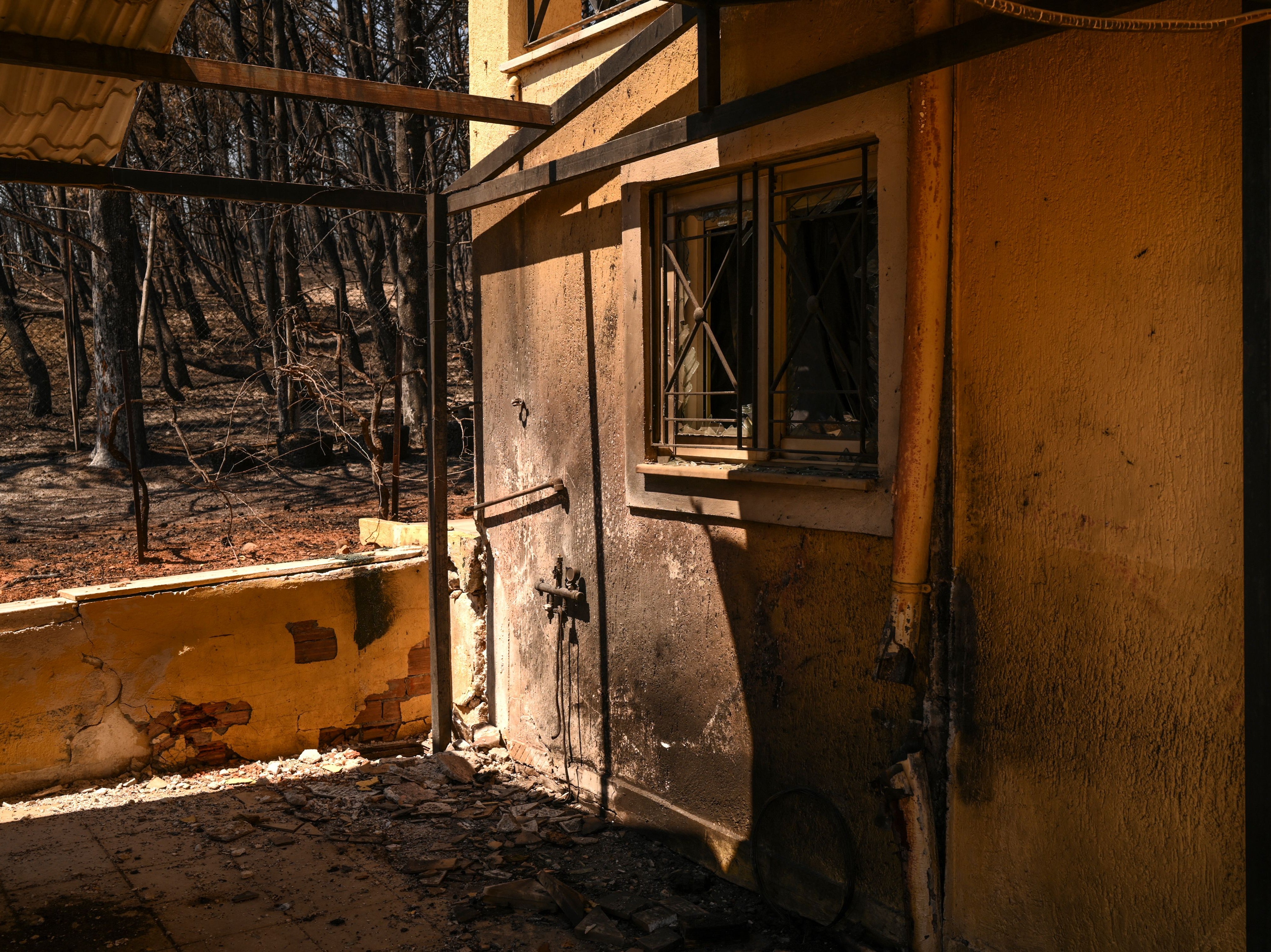 A house in Eleni Haniosakis following a wildfire in the village of Krioneri, north of Athens, in August