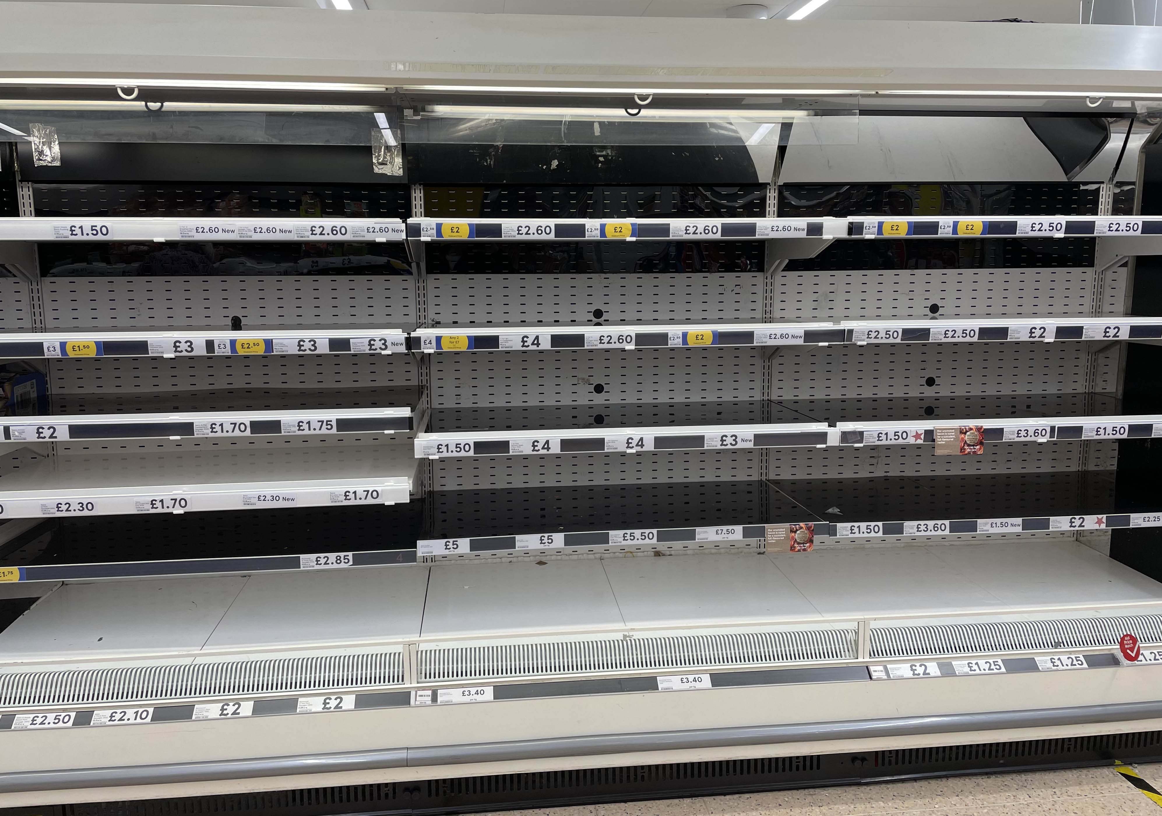 Empty shelves in the meat aisle of a branch of Tesco in Liverpool in September (PA)