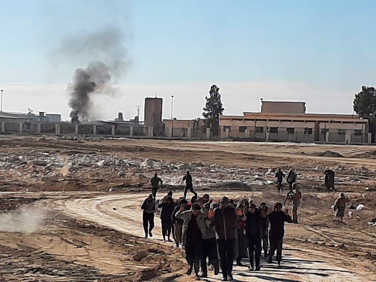 Islamic State militants surrender after clashing with Kurdish-led Syrian Democratic Forces, at Gweiran Prison