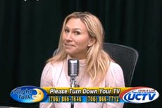 Marjorie Taylor Greene smiles awkwardly as caller says she is ‘an embarrassment to the state of Georgia’