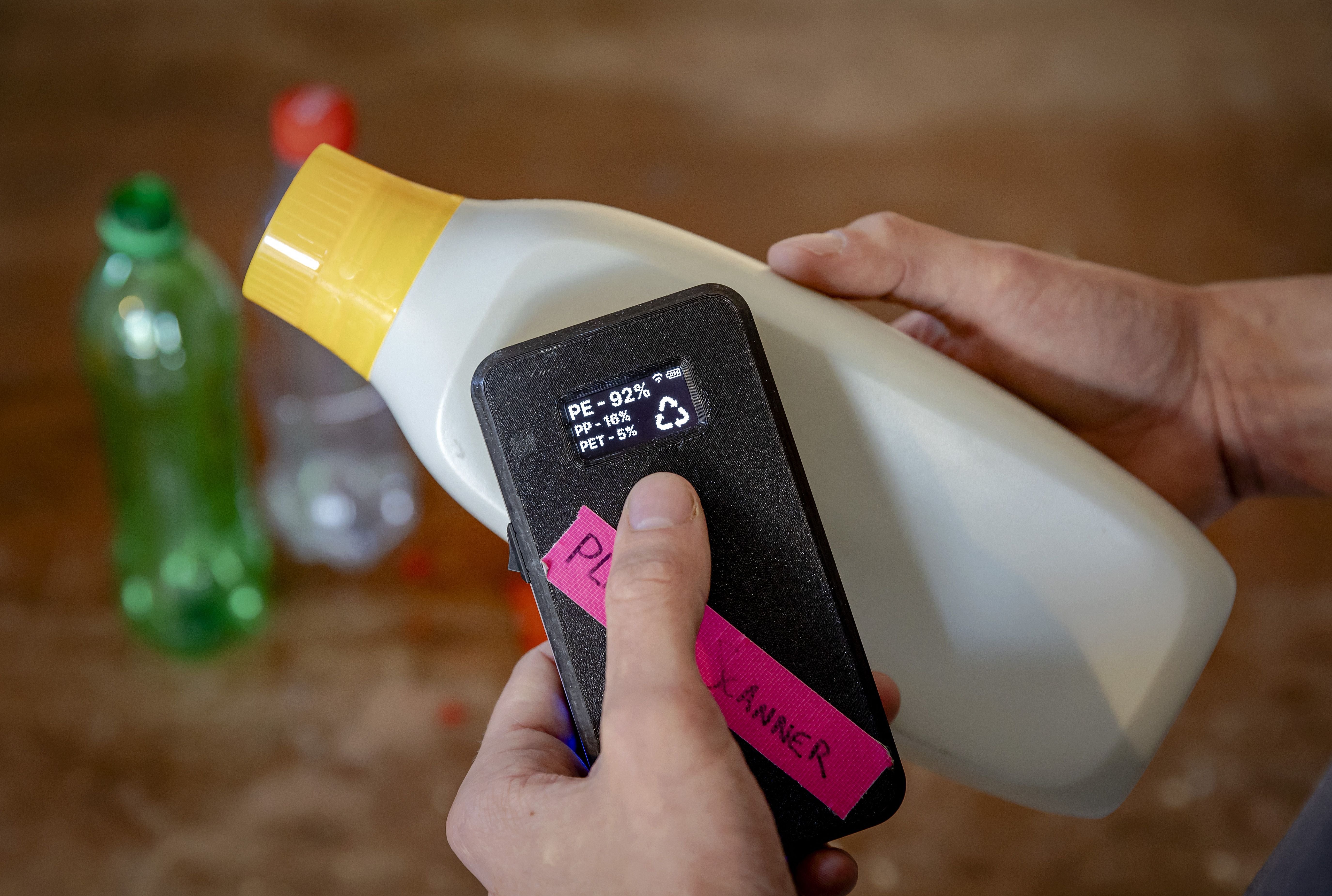 Dutch student Jerry de Vos shows his invention, a plastic scanner that identifies what type of plastic a product is made of, for which he was awarded the 2021 James Dyson award for Sustainability