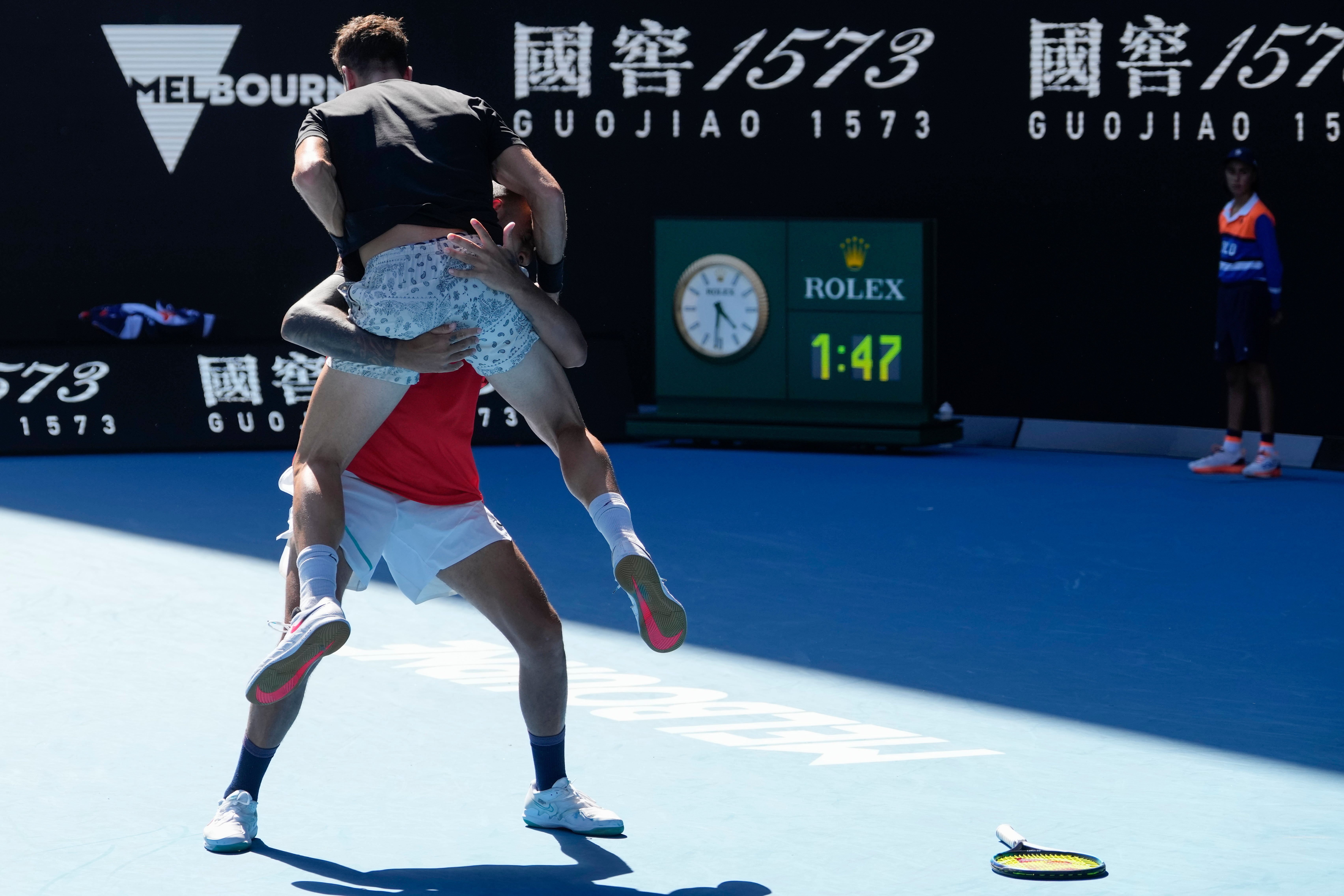 Thanasi Kokkinakis jumps into Nick Kyrgios’ arms (Simon Baker/AP)