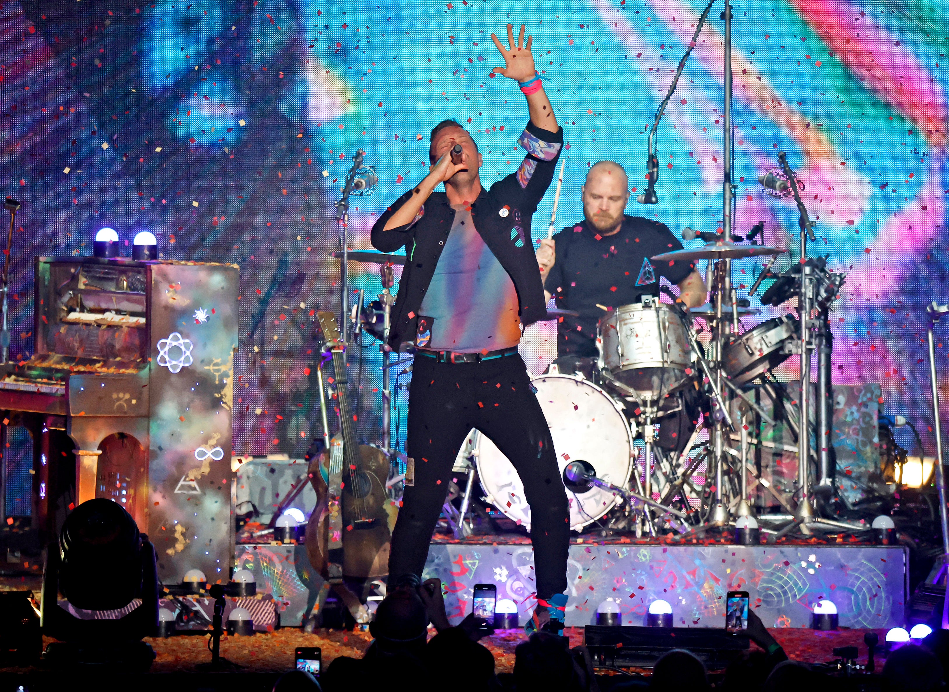 Martin on stage with Coldplay earlier this month