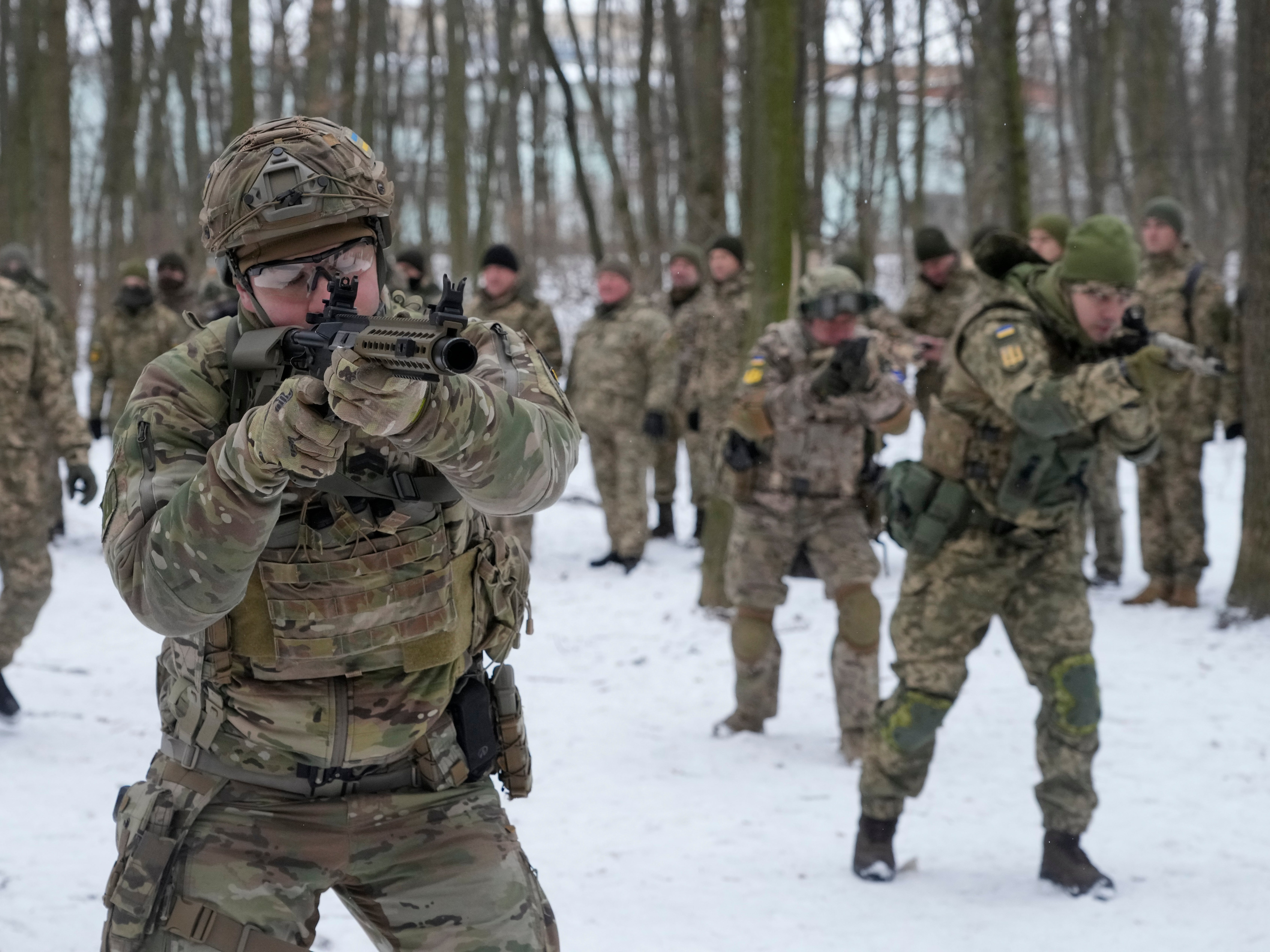 Members of Ukraine's Territorial Defense Forces, volunteer military units of the Armed Forces, train in a city park in Kyiv, Ukraine