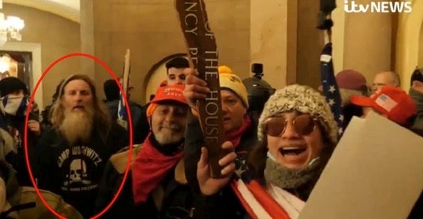 Robert Packer is seen inside the US Capitol in his ‘Camp Auschwitz’ shirt