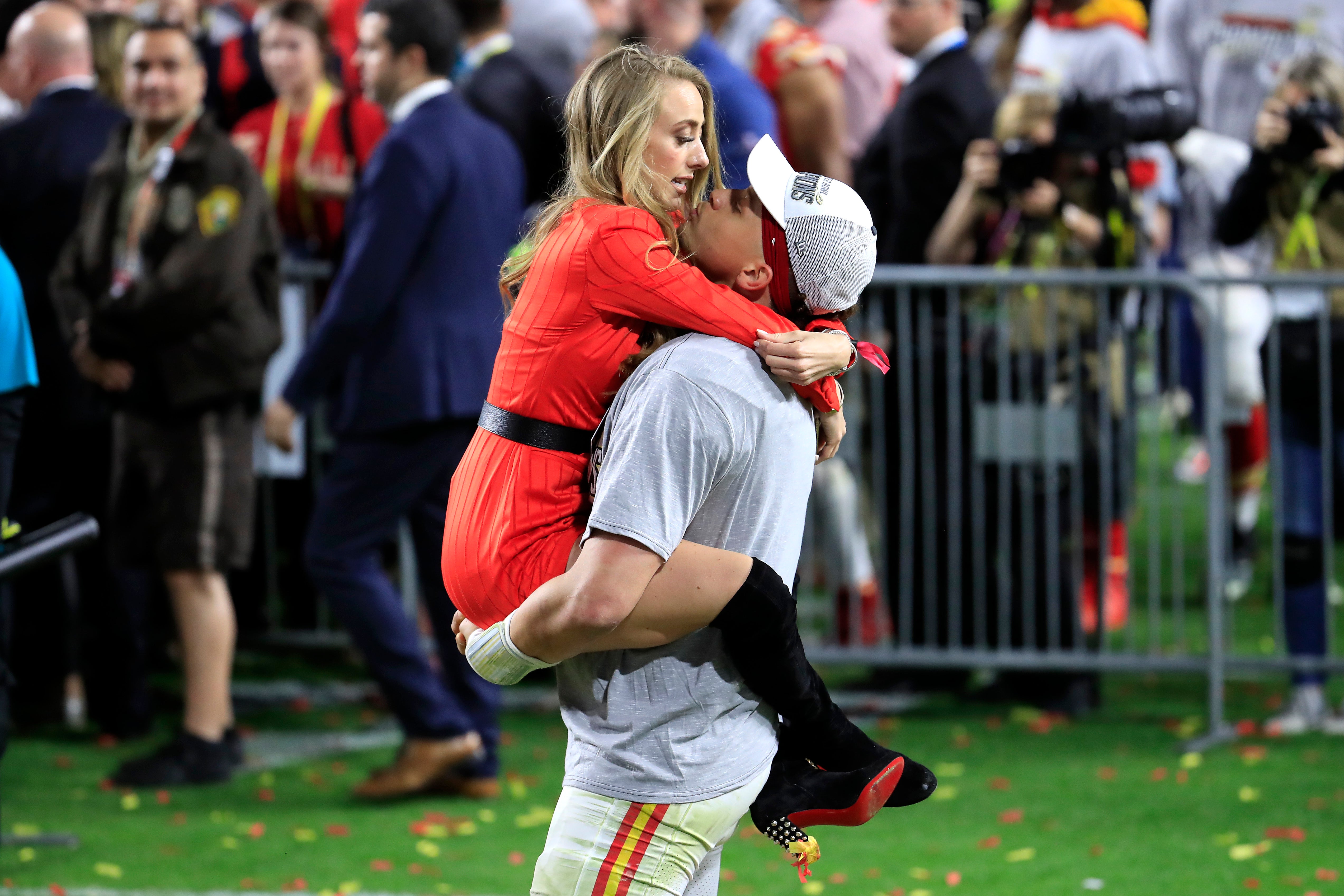 Patrick Mahomes of the Kansas City Chiefs celebrates with his girlfriend, Brittany Matthews