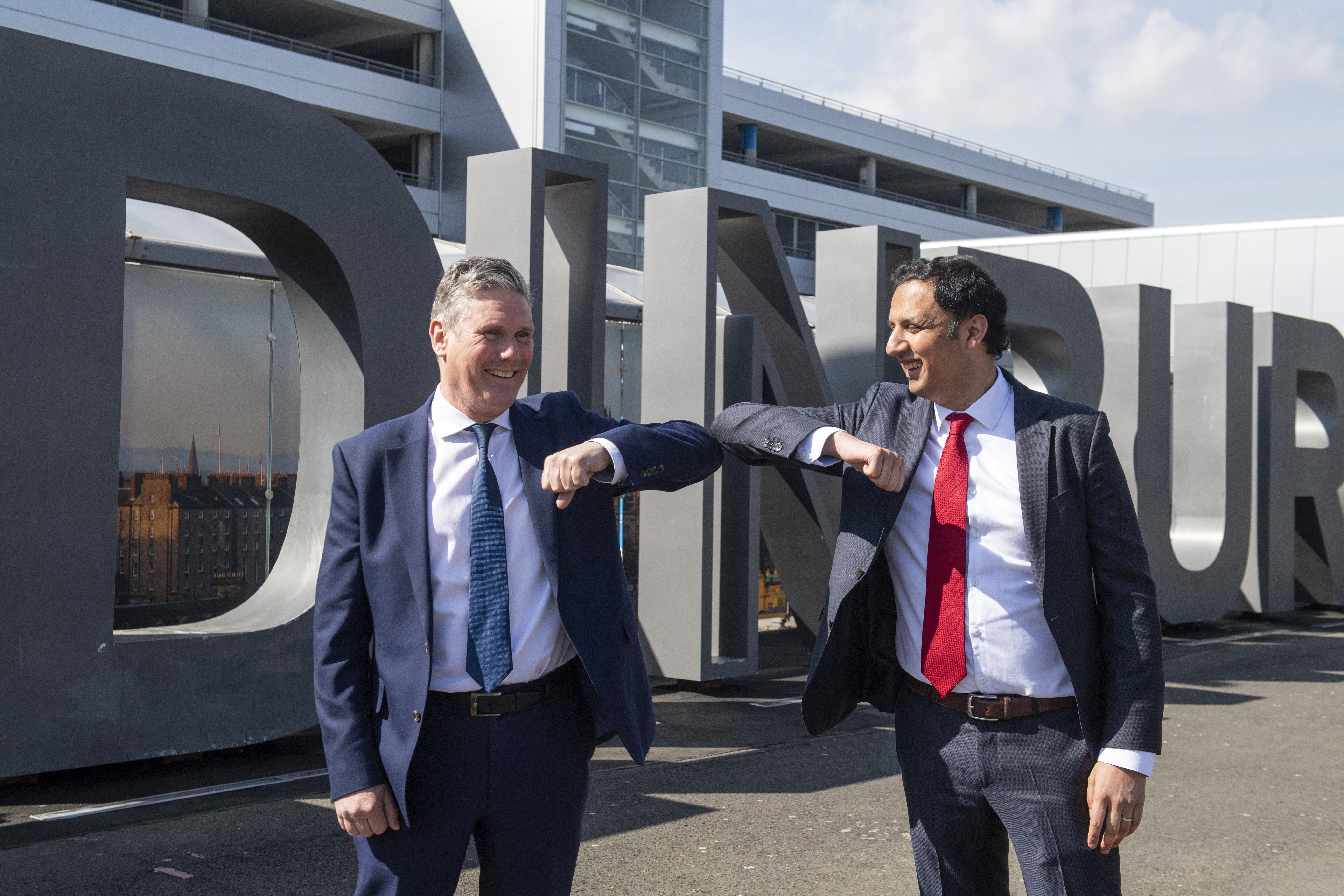 Labour leaders Sir Keir Starmer and Anas Sarwar are demanding action from government on both sides of the border to ease the rising cost of living (PA)