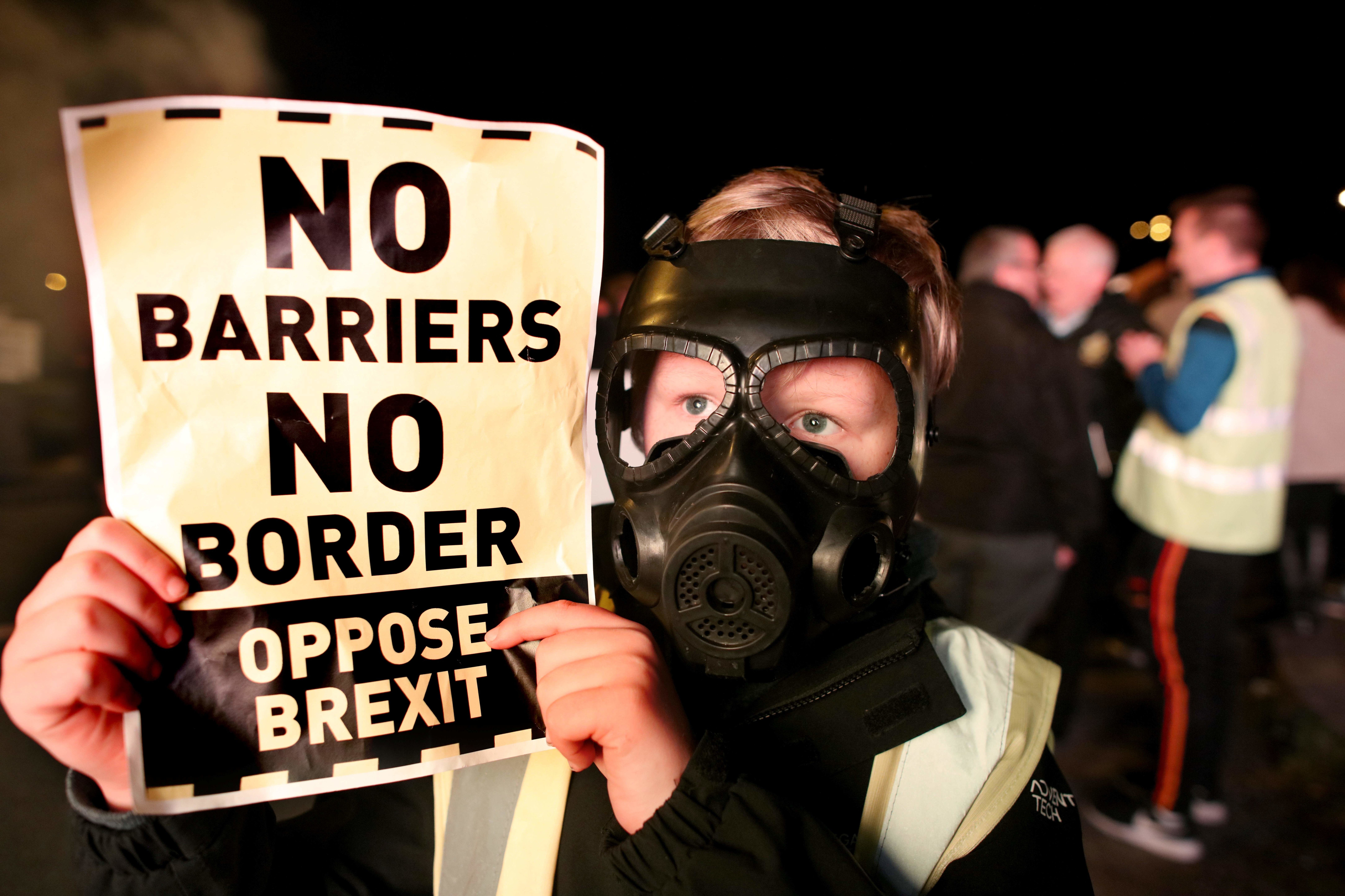 Demonstrators from Border Communities Against Brexit attend a protest at the Carrickcarnon border crossing on the road between Dundalk and Newry, on 16 October 2019