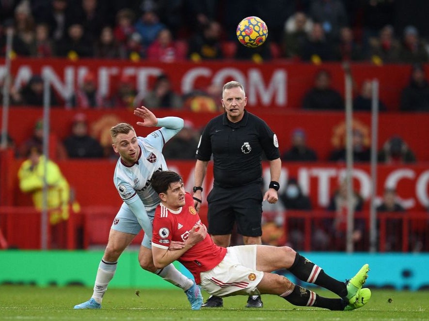 Harry Maguire challenges West Ham’s Jarrod Bowen