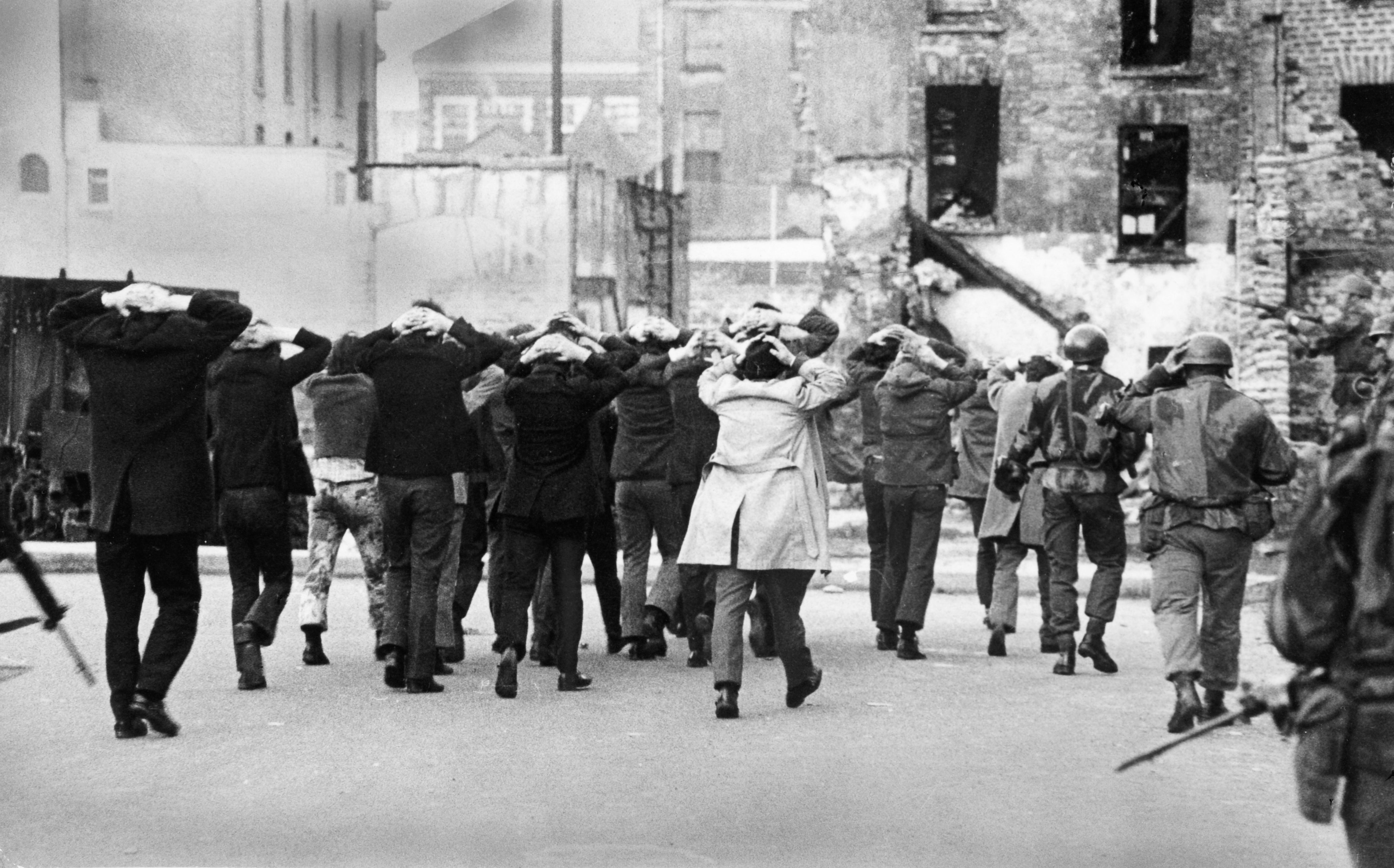 British soldiers marching away civilian detainees in the Bogside area of Derry on Bloody Sunday