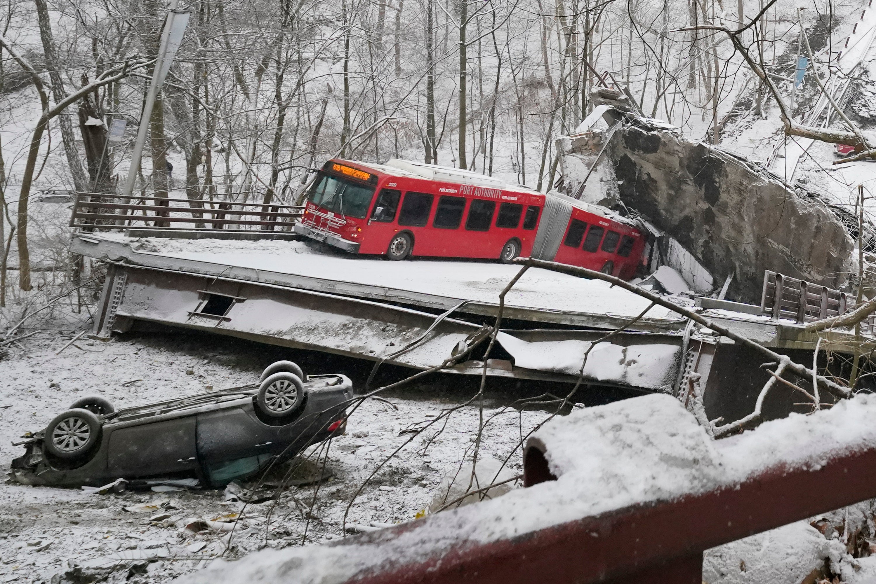 A Port Authority bus and a car that were on the bridge when it collapsed early on Friday