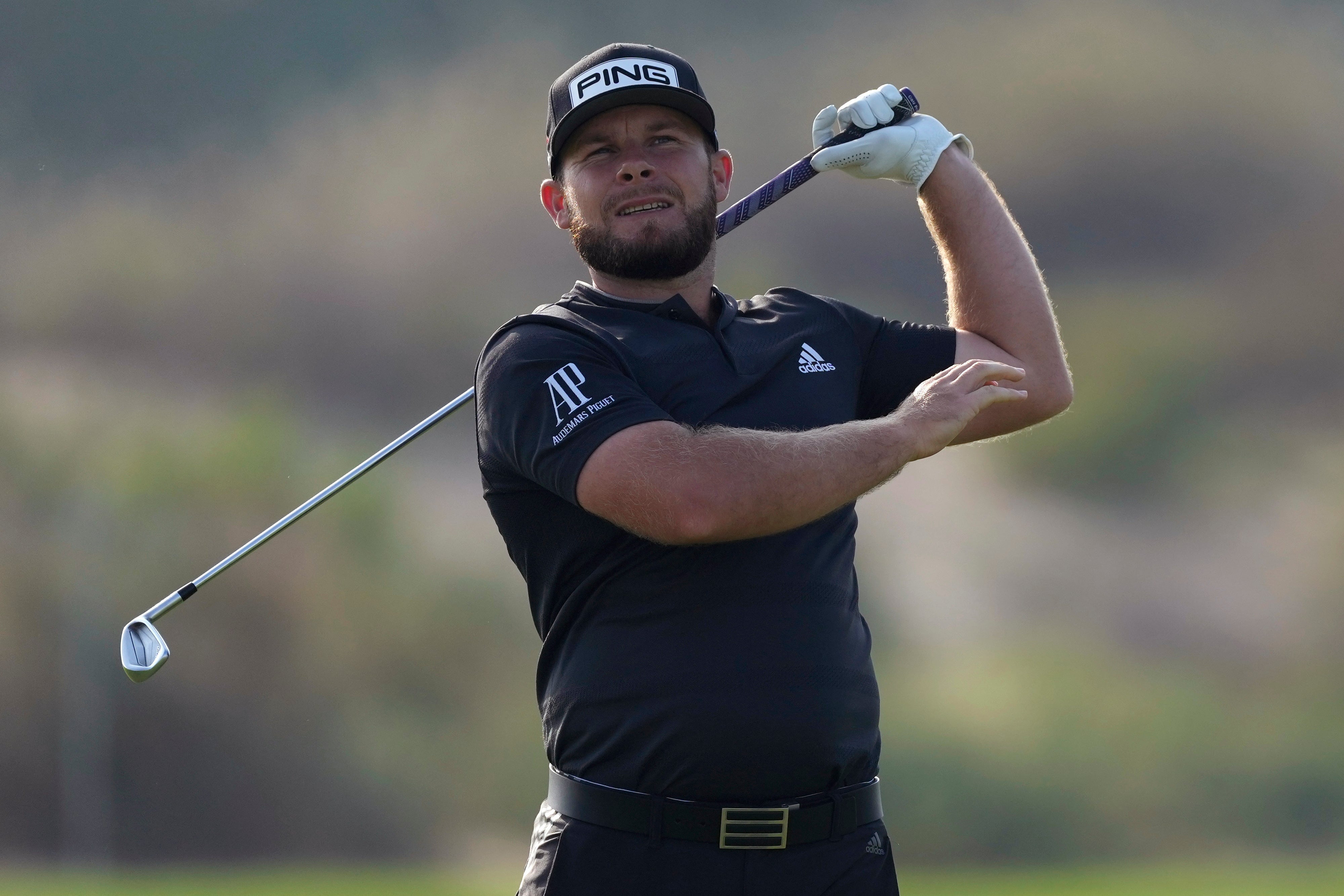 England’s Tyrrell Hatton reacts on the 13th hole during the second round of the Dubai Desert Classic (Kamran Jebreili/AP)