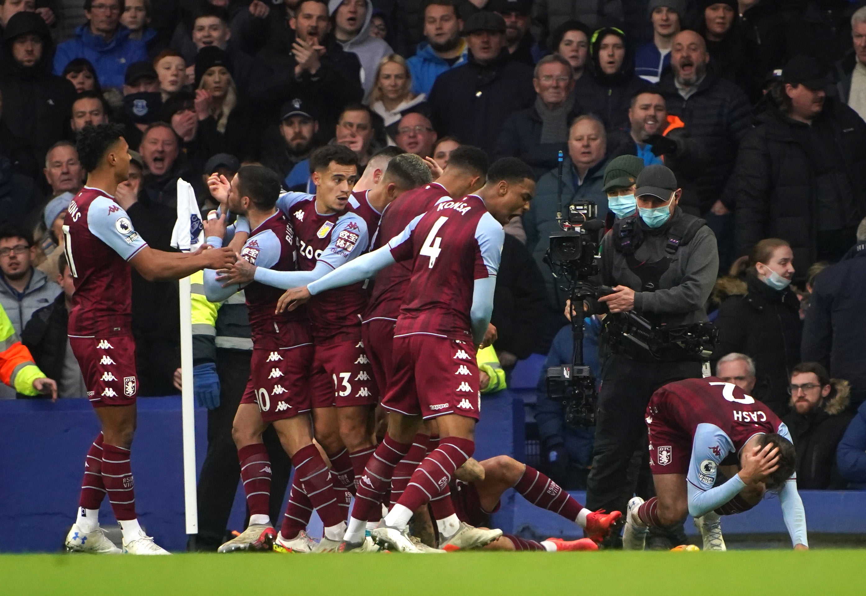 Aston Villa’s Lucas Digne and Matty Cash react to being hit by a missile at Everton (Peter Byrne/PA)