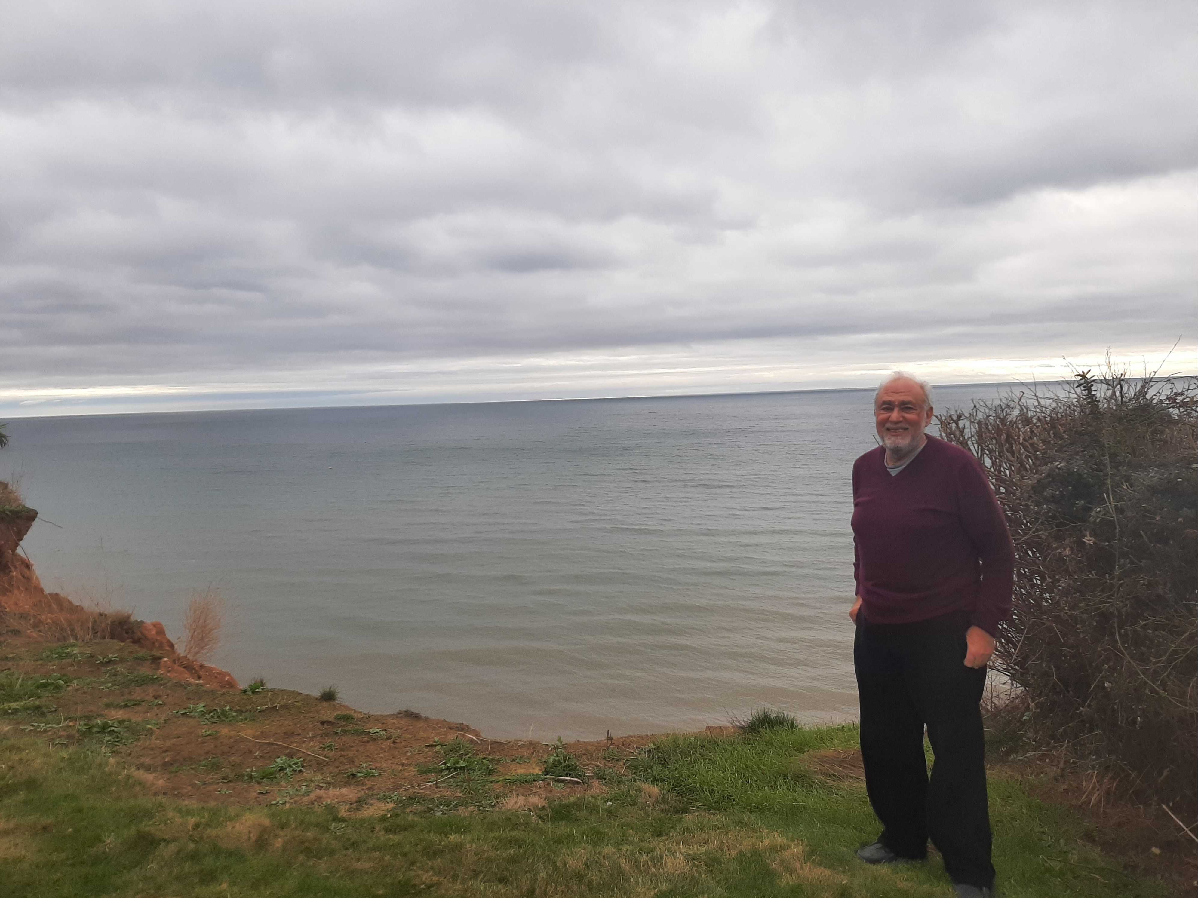 Paul Griew in his Devon garden, which has lost around 20 metres to the sea