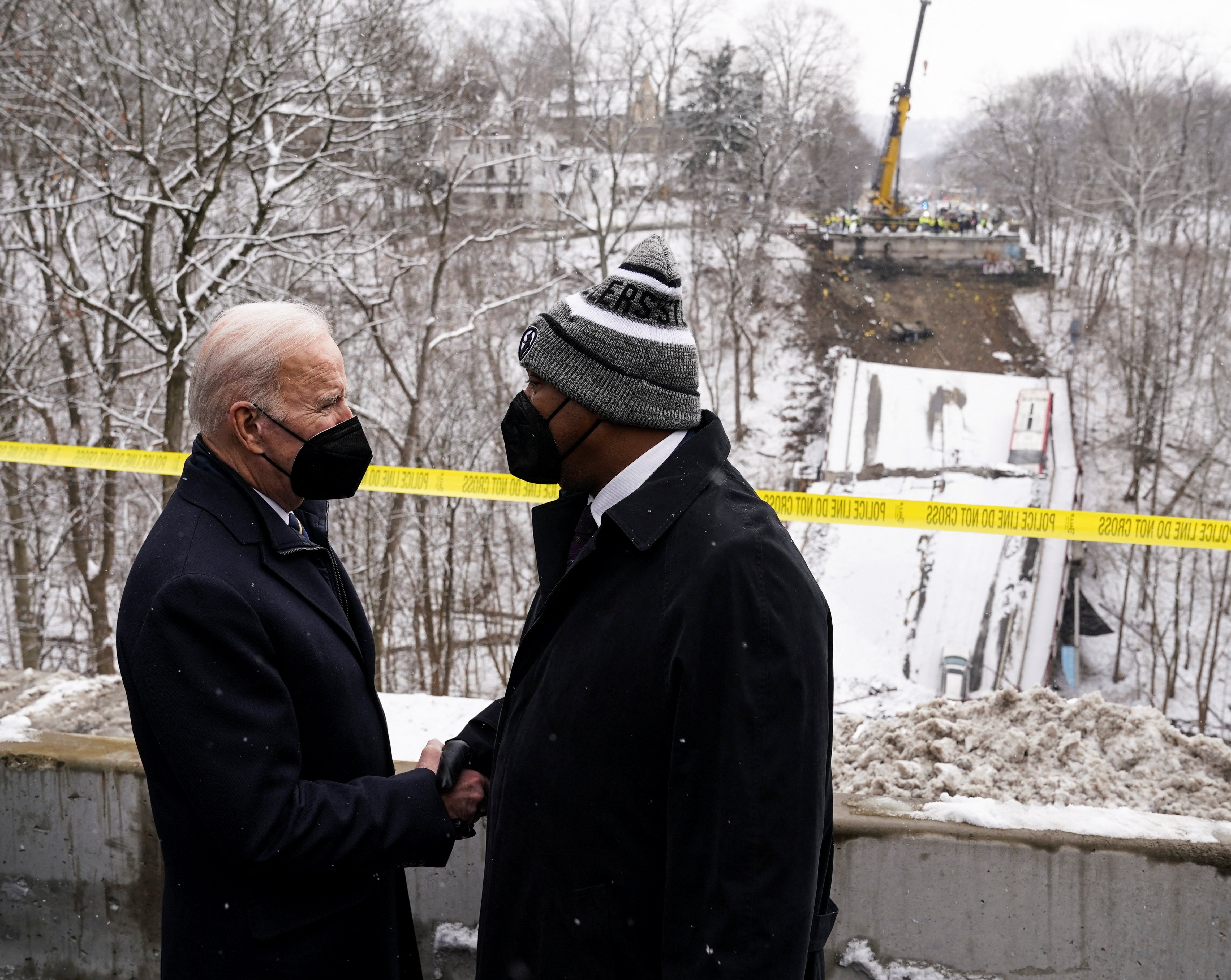 President Joe Biden is greeted by Pittsburgh Mayor Ed Gainey at the site of a bridge collapse