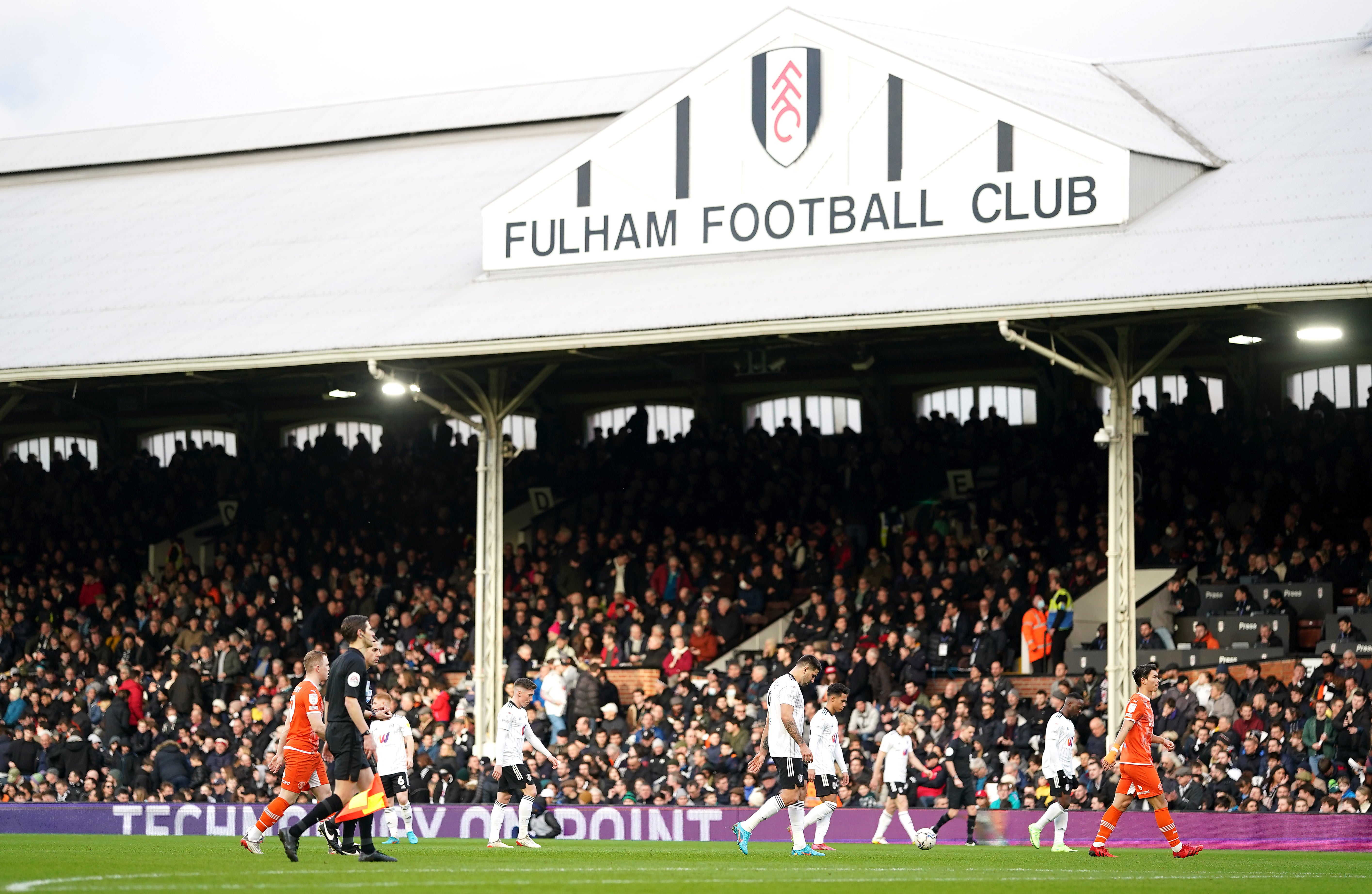 Fulham and Blackpool players leave the pitch (Adam Davy/PA)