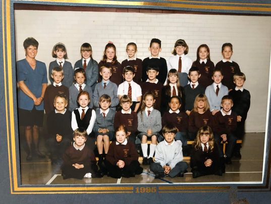 A photograph of Joanna’s (pictured second row, four from right) class at Peterhead Central School in 1995. Her teacher, Mrs Skinner stands at the far left of the frame. Joanna’s “best, best, best friend" (Donna) is second from the left on the top row. William, her “Blu Tack collecting buddy”, sits on the front row, right of the centre.