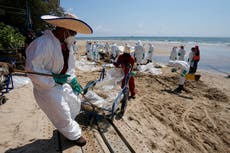 Weather, cleanup keep oil slick away from Thai resort island